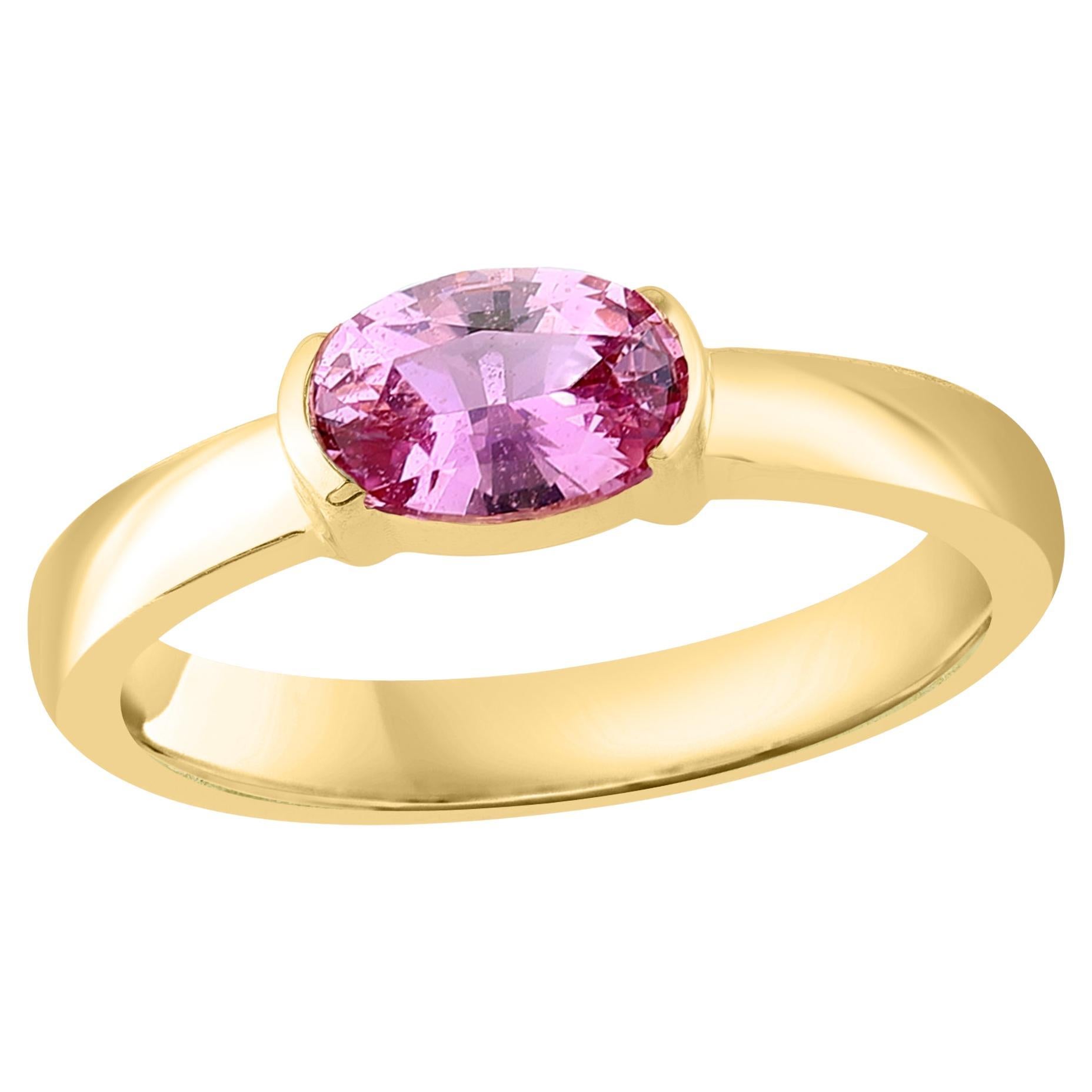 0.73 Carat Oval Cut Pink Sapphire Band Ring in 14K Yellow Gold For Sale