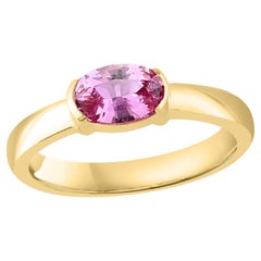 Bague jonc en or jaune 14 carats avec saphir rose de taille ovale de 0,73 carat