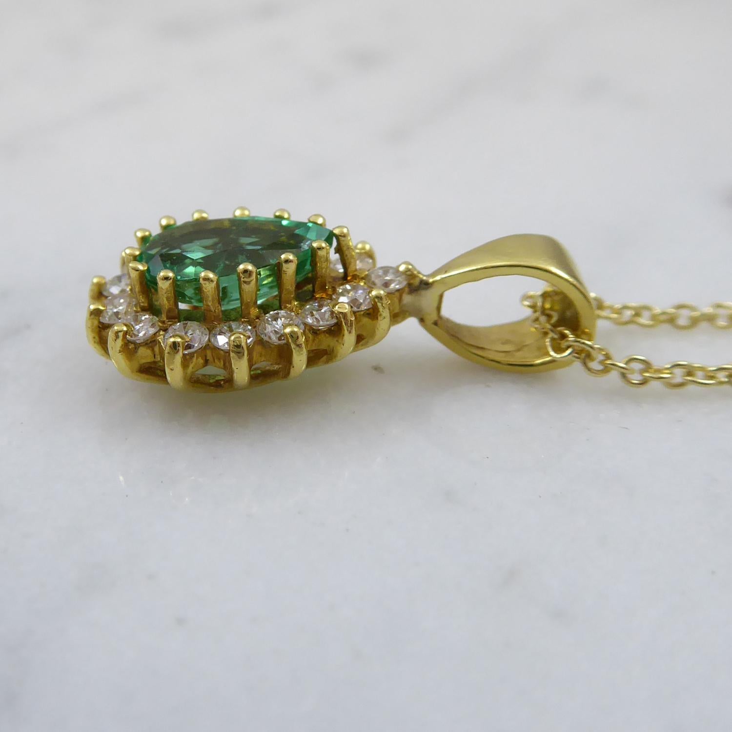 Pear Cut 0.73 Carat Pear-Shaped Emerald Pendant in Diamond Surround, Yellow Gold 