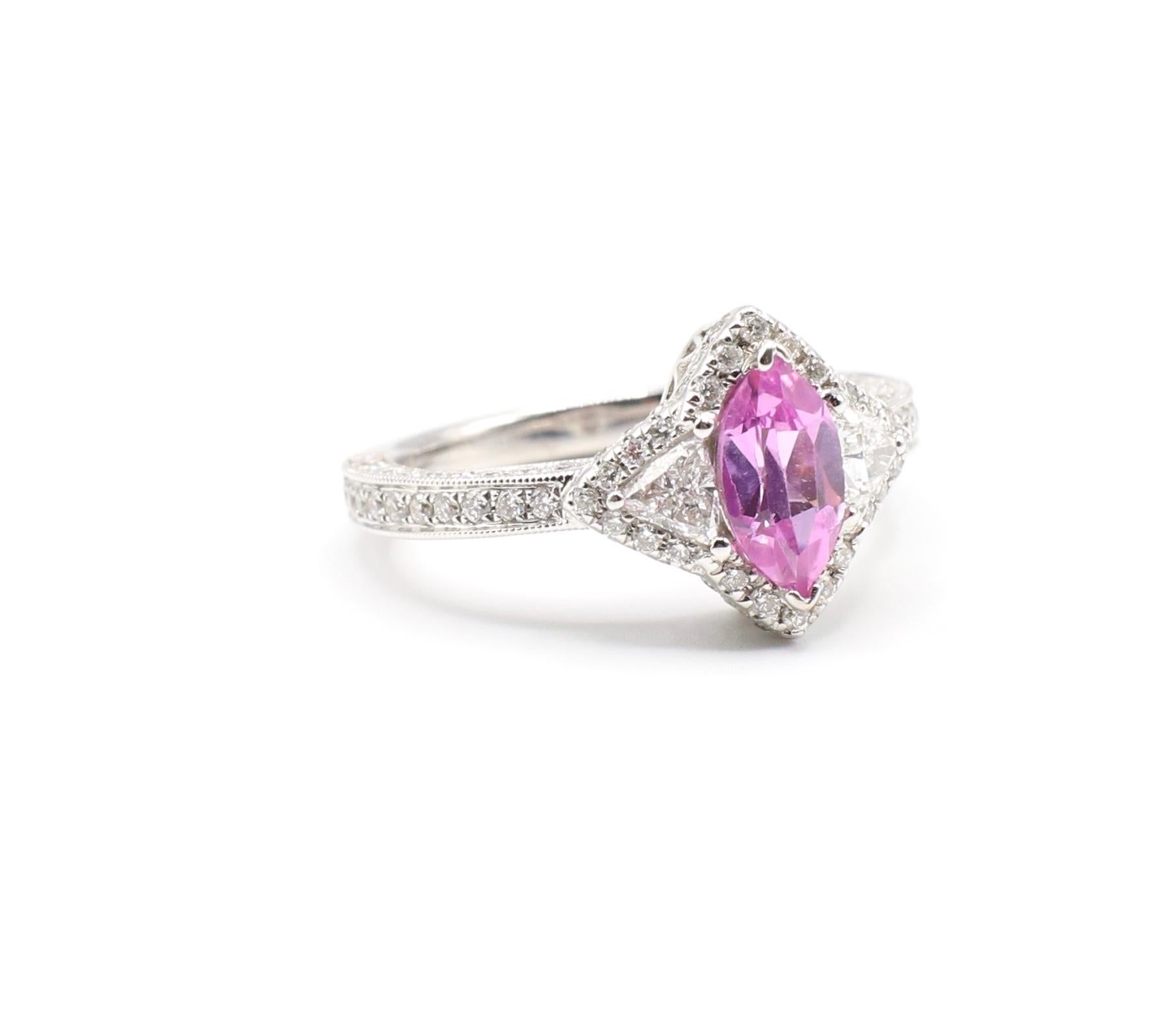 0.73 Carat Pink Sapphire & Pave Diamond 14K White Gold Cocktail Ring Size 6 

Metal: 14k White Gold
Gemstone: Pink Sapphire Marquise shape, 0.73 carats 
Diamonds: 2 trillion diamonds & 108 round brilliant cut diamonds,  0.981 CTW G VS
Finger Size: