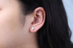 0.73 Carat Round-cab Ethiopian Opal with Diamond Accents 10K Yellow Gold Earring