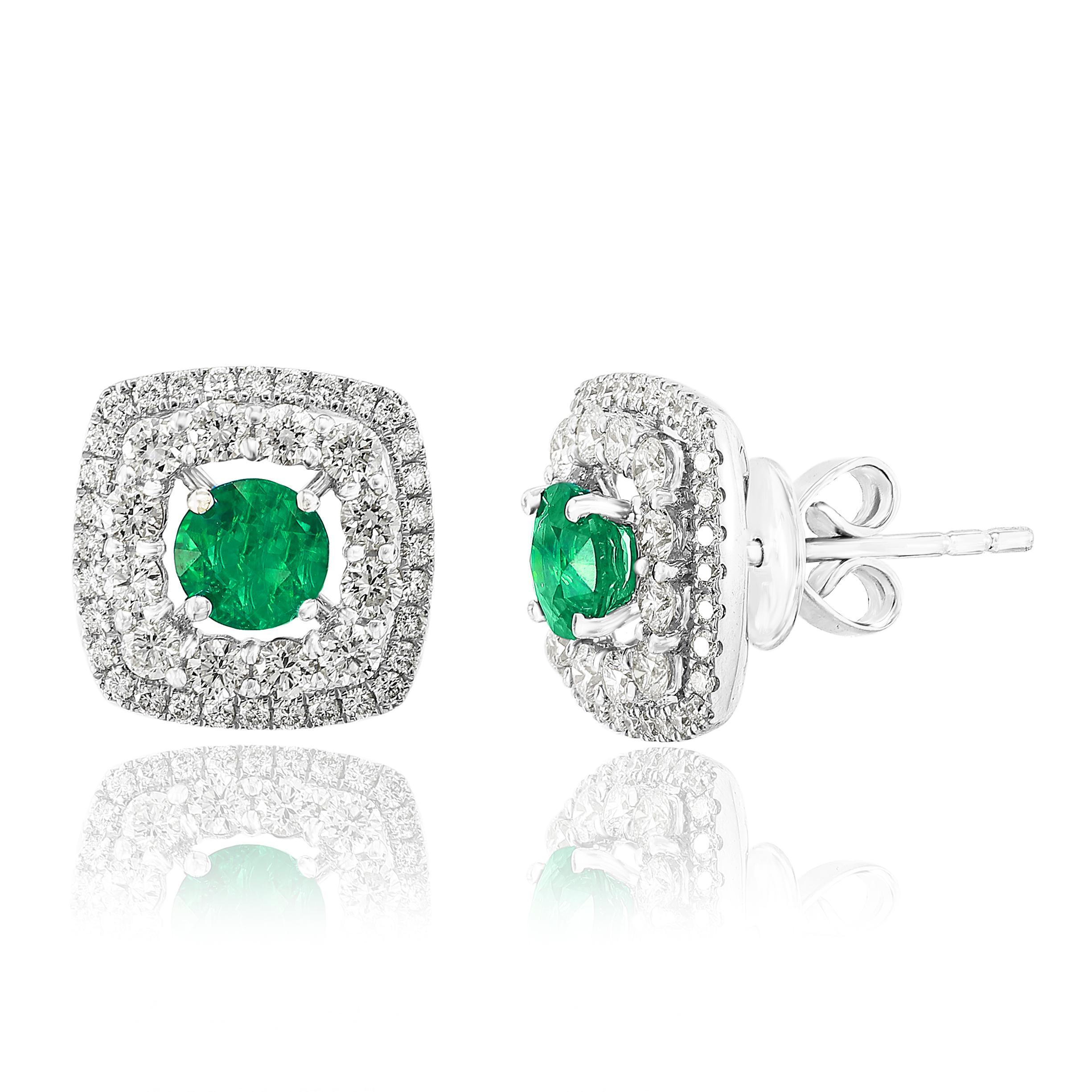 A simple pair of stud earrings showcasing 0.73 carats of round shape 2 green emeralds, surrounded by a double row of 88 brilliant round diamonds weighing 1.11 carats and made in 18-karat white gold.