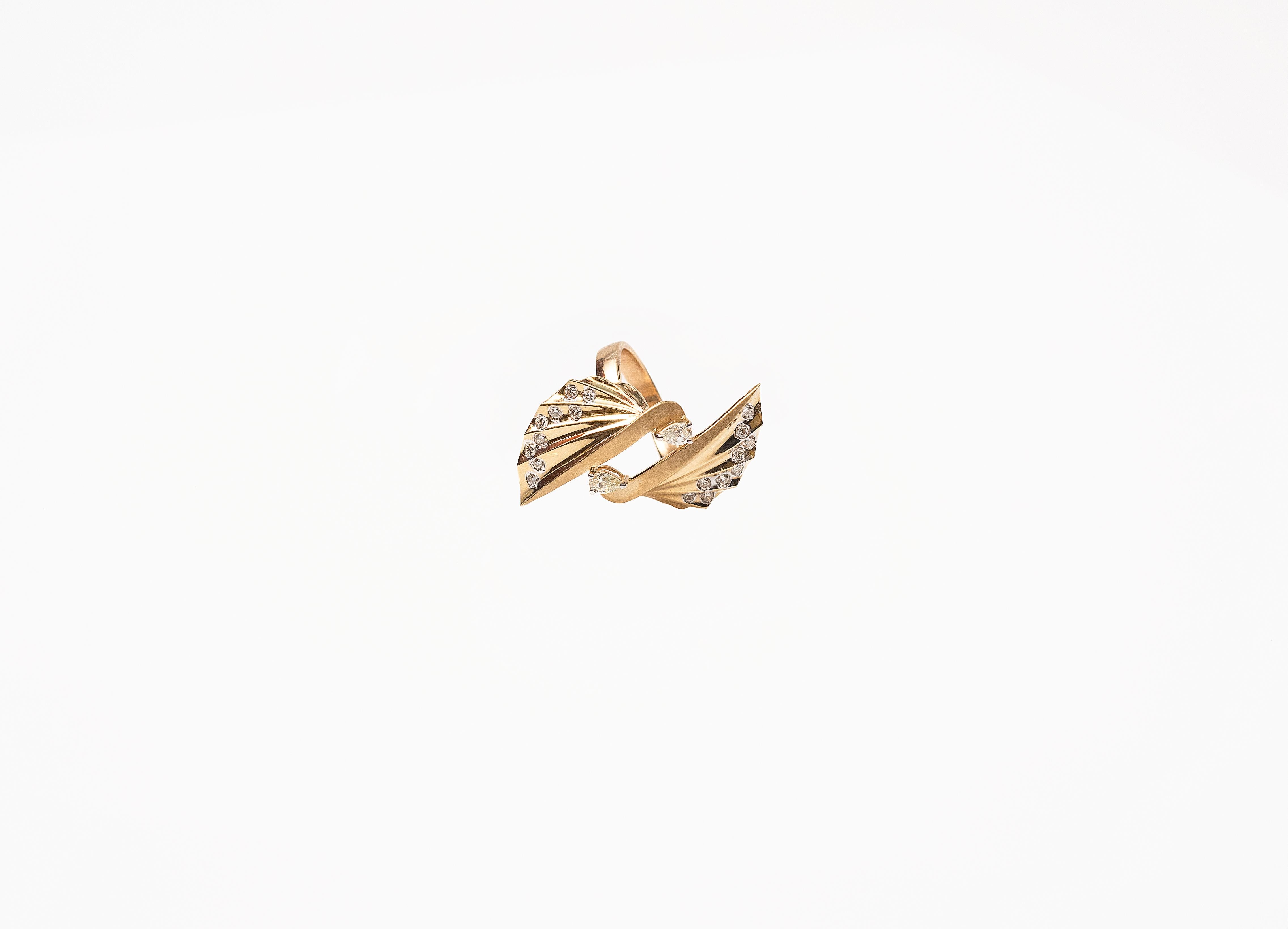 Handcrafted Cocktail ring in 18K Yellow Gold Studded with Pear & round Diamonds.
Inspired by Japanese Paper Art 