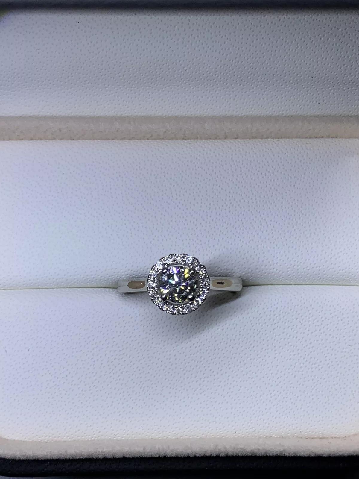0.73ct Round Brilliant Diamond GIA certif solitaire engagement ring in platinum.

GIA certified round brilliant diamond centre diamond total weight 0.53ct G colour VS2 clarity

Classic solitaire round diamond with halo around engagement ring in