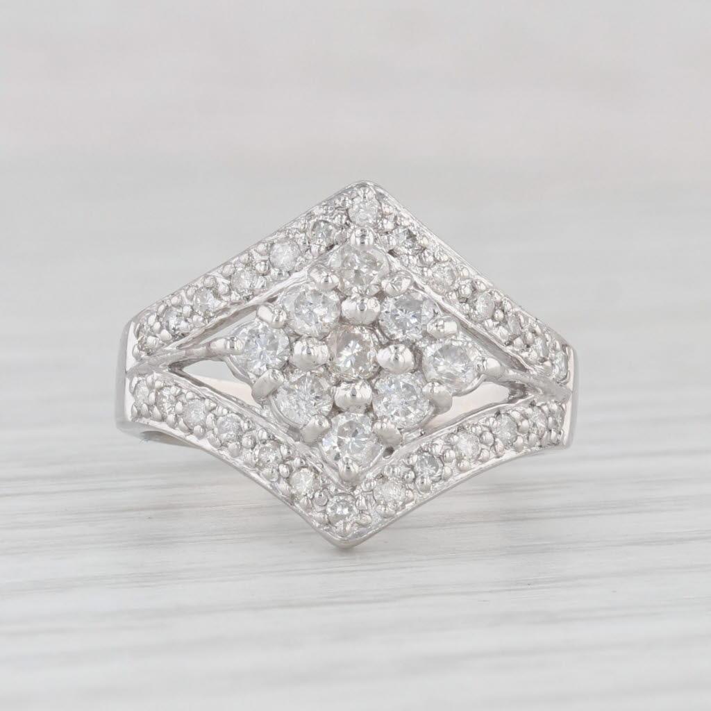 Gemstone Information:
- Natural Diamonds -
Total Carats - 0.73ctw
Cut - Round Brilliant
Color - K - M
Clarity - I1 - I2

Metal: 900 Platinum
Weight: 8.4 Grams 
Stamps: pt 900
Face Height: 15.6 mm 
Rise Above Finger: 4.8 mm
Band / Shank Width: 3.3