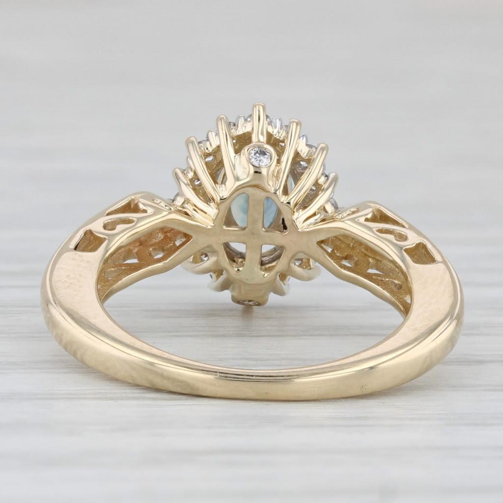 Gemstone Information:
- Natural Sapphire -
Carats - 0.50ct 
Cut - Oval Brilliant
Color - Aqua Blue
Treatment - Heated

- Natural Diamonds -
Total Carats - 0.23ctw
Cut - Round Brilliant
Color - G - H
Clarity - SI1 - I1

Metal: 14k Yellow Gold
Weight: