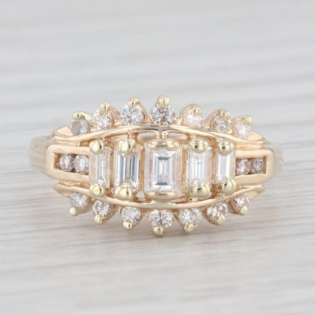 Gemstone Information:
- Natural Diamonds -
Total Carats - 0.73ctw
Cut - Round Brilliant 0.33ctw, Baguette 0.40ctw
Color - G - H
Clarity - SI2 - I1

Metal: 14k Yellow Gold
Weight: 3.6 Grams 
Stamps: 14k
Face Height: 10.2 mm 
Rise Above Finger: 6.4