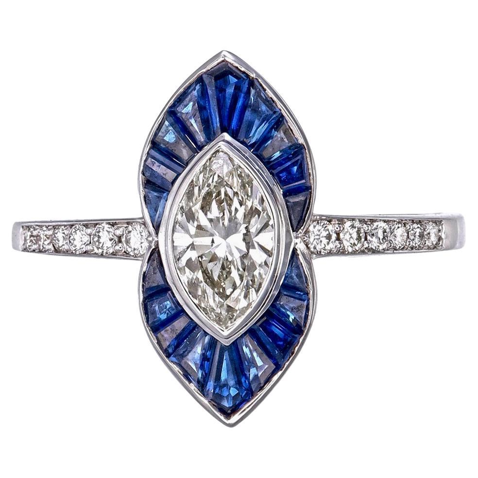 Bague en or blanc 18 carats avec saphir bleu et diamant de 0,74 carat