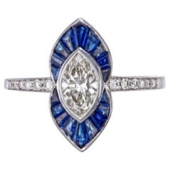 Bague en or blanc 18 carats avec saphir bleu et diamant de 0,74 carat