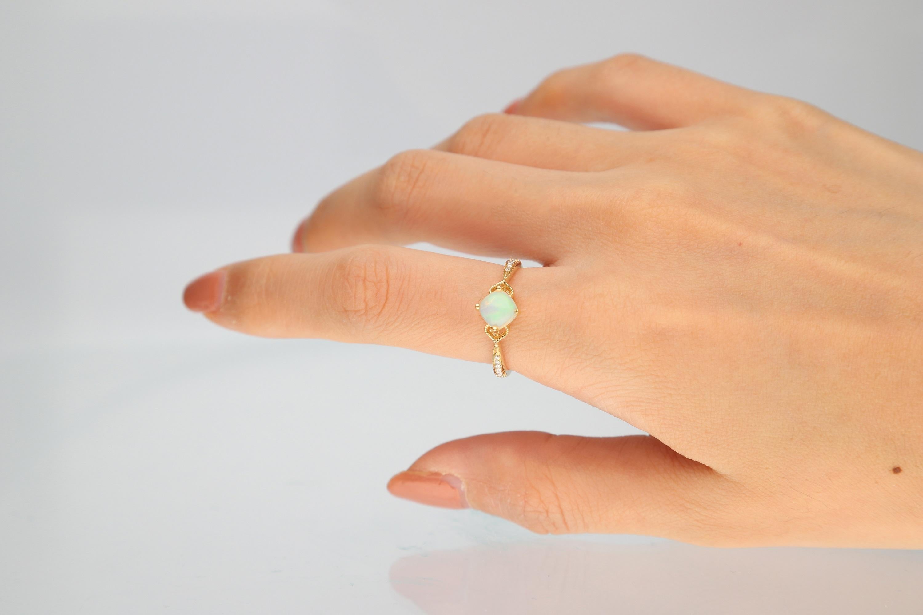 Decorate yourself in elegance with this Ring is crafted from 14-karat Yellow Gold by Gin & Grace Ring. This Ring is made up of 6.0 mm Cushion-Cut Ethiopian Opal (1Pcs) 0.74 Carat and Round-cut White Diamond (12 Pcs) 0.05 Carat. This Ring is weight