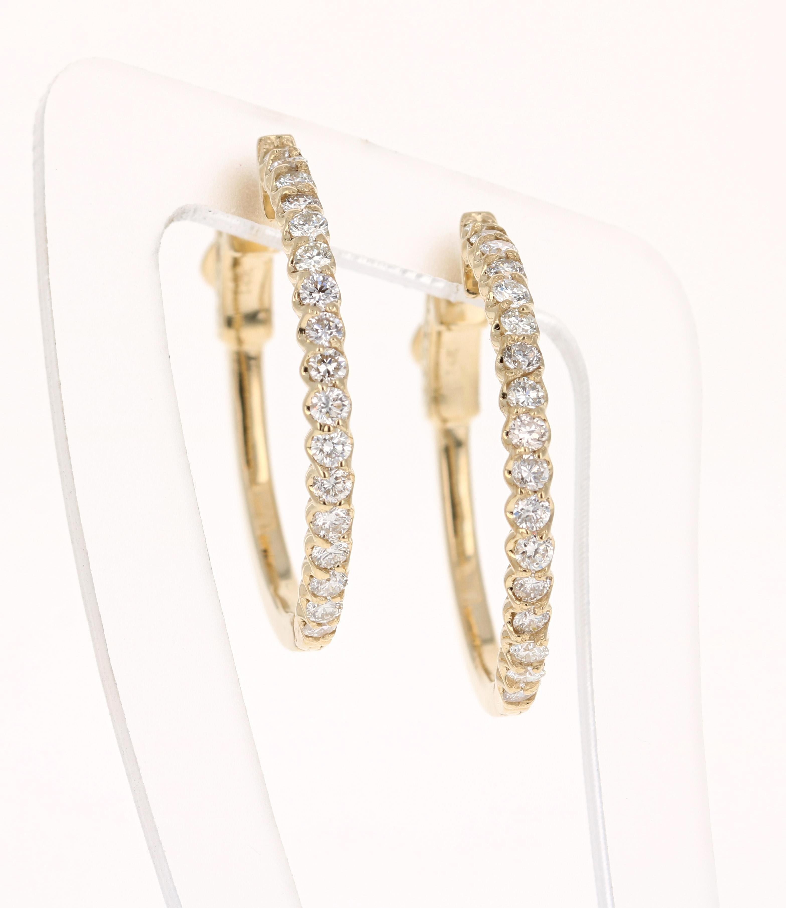 These hoop earrings have 34 Round Cut Diamonds that weigh 0.74 Carats. (Clarity: VS, Color: H)

The hoops are set in 14 Karat Yellow Gold and weigh approximately 4.7 grams. They are approximately a little less than 1 inch wide. 

