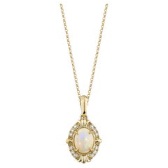 0.74 Carat Ethiopian Opal Pendant in 14Karat Yellow Gold with White Diamond.