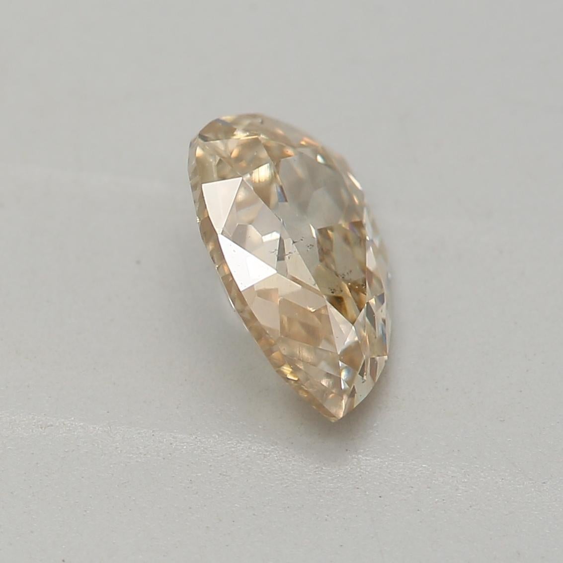 Women's or Men's 0.74 Carat Fancy Light Yellow Brown Pear cut diamond SI1 Clarity GIA Certified For Sale