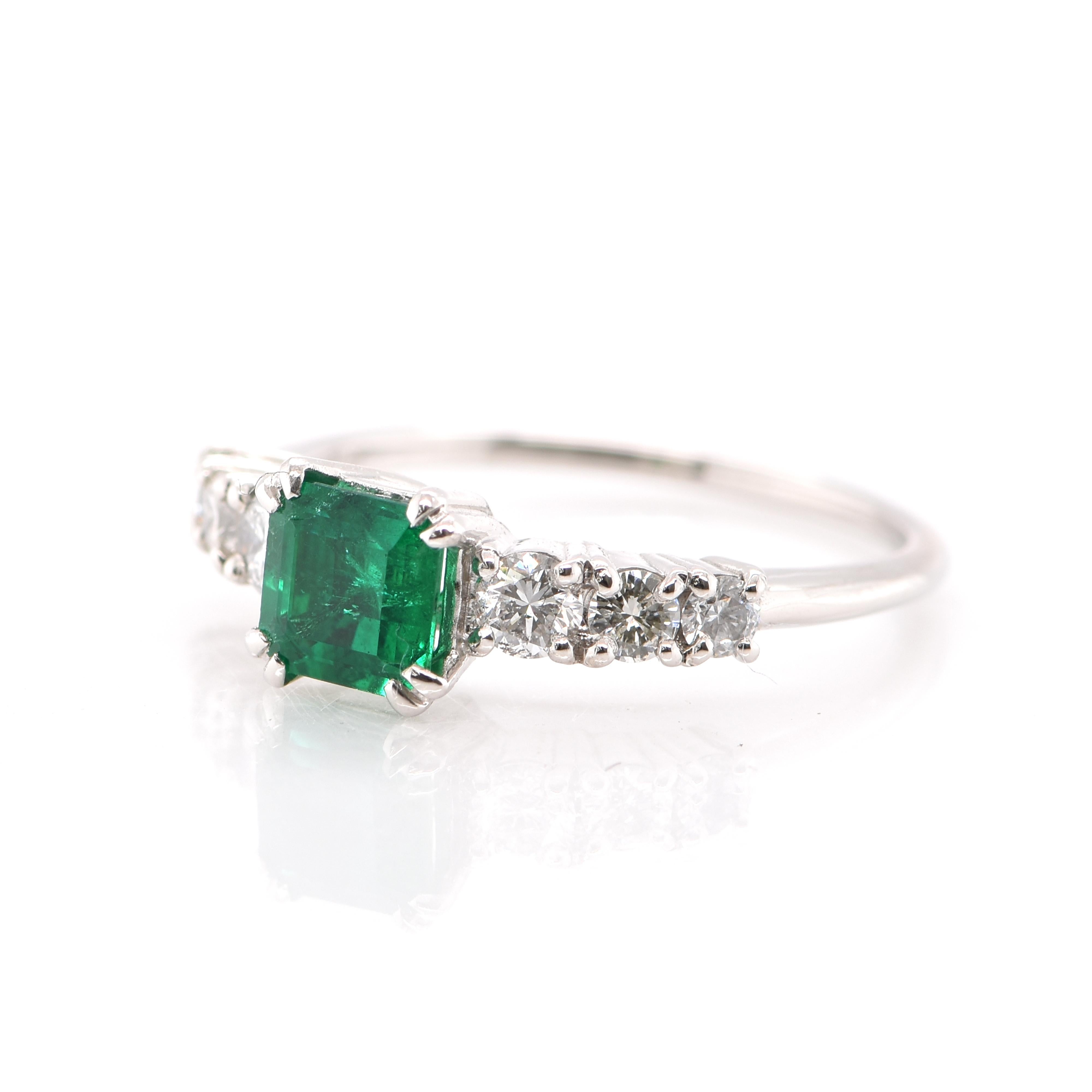 A stunning Engagement Ring featuring a 0.74 Carat Natural Emerald and 0.41 Carats of Diamond Accents set in Platinum. People have admired emerald’s green for thousands of years. Emeralds have always been associated with the lushest landscapes and
