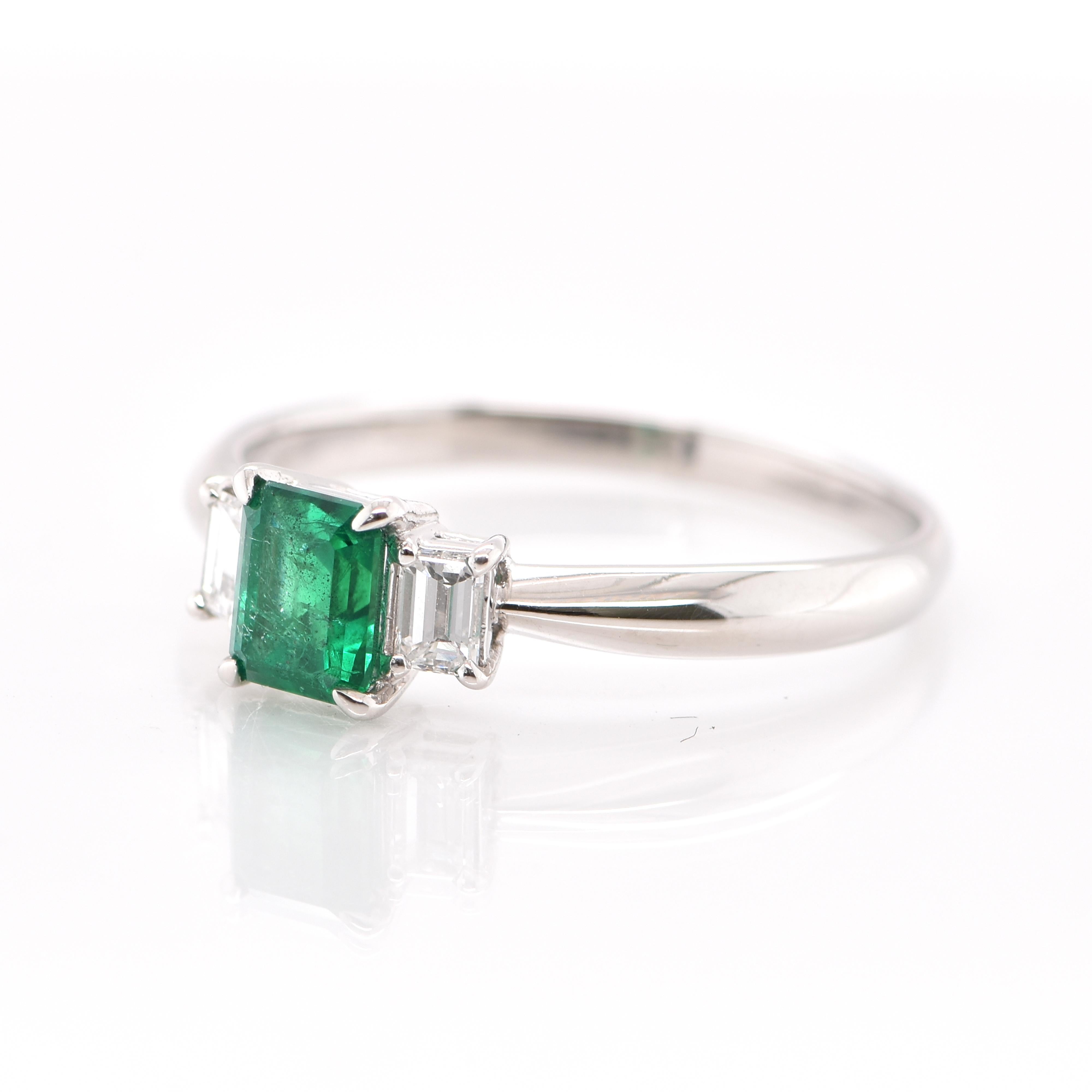 A stunning Engagement Ring featuring a 0.74 Carat Natural Emerald and 0.28 Carats of Diamond Accents set in Platinum. People have admired emerald’s green for thousands of years. Emeralds have always been associated with the lushest landscapes and