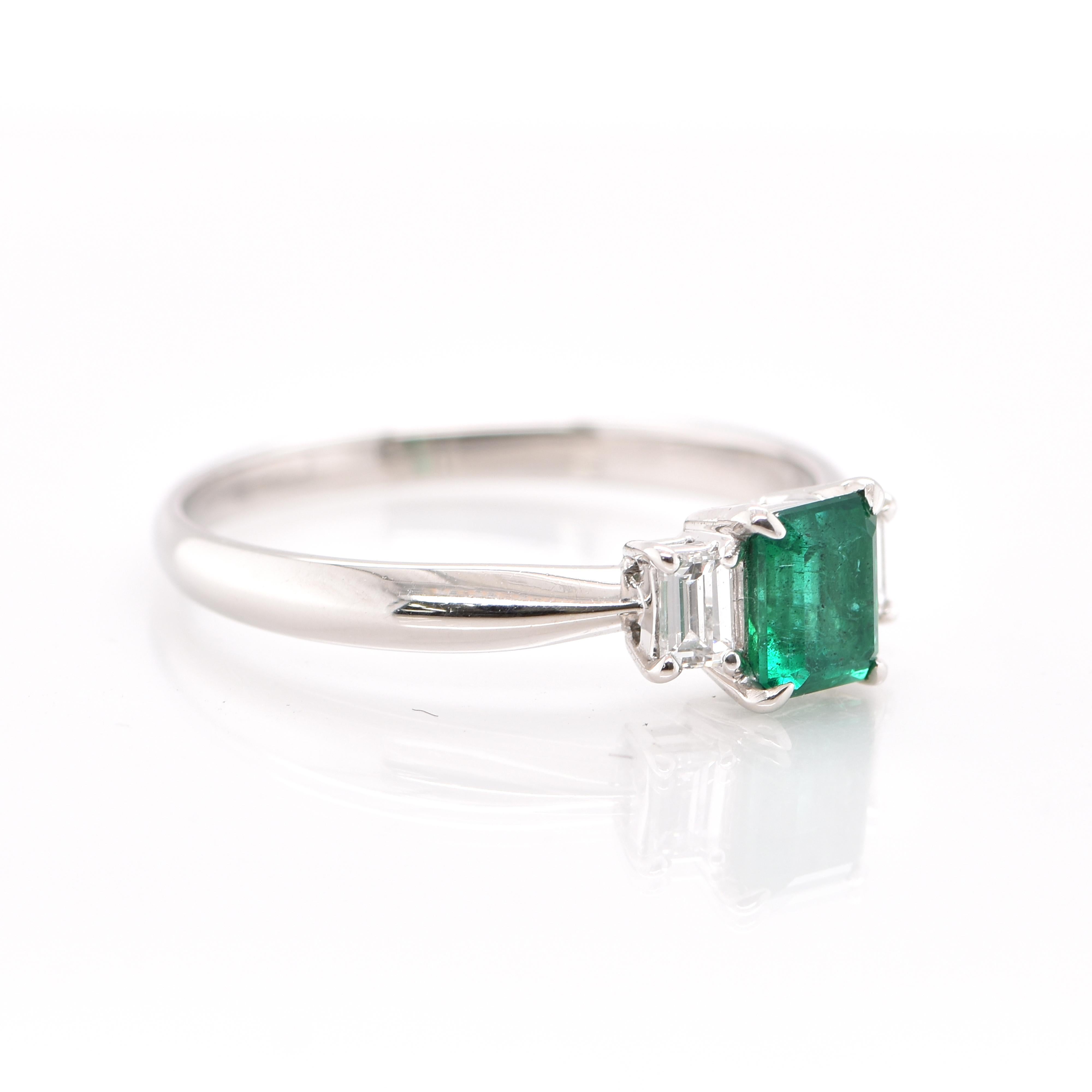 Modern 0.74 Carat Natural Emerald and Diamond Engagement Ring Set in Platinum