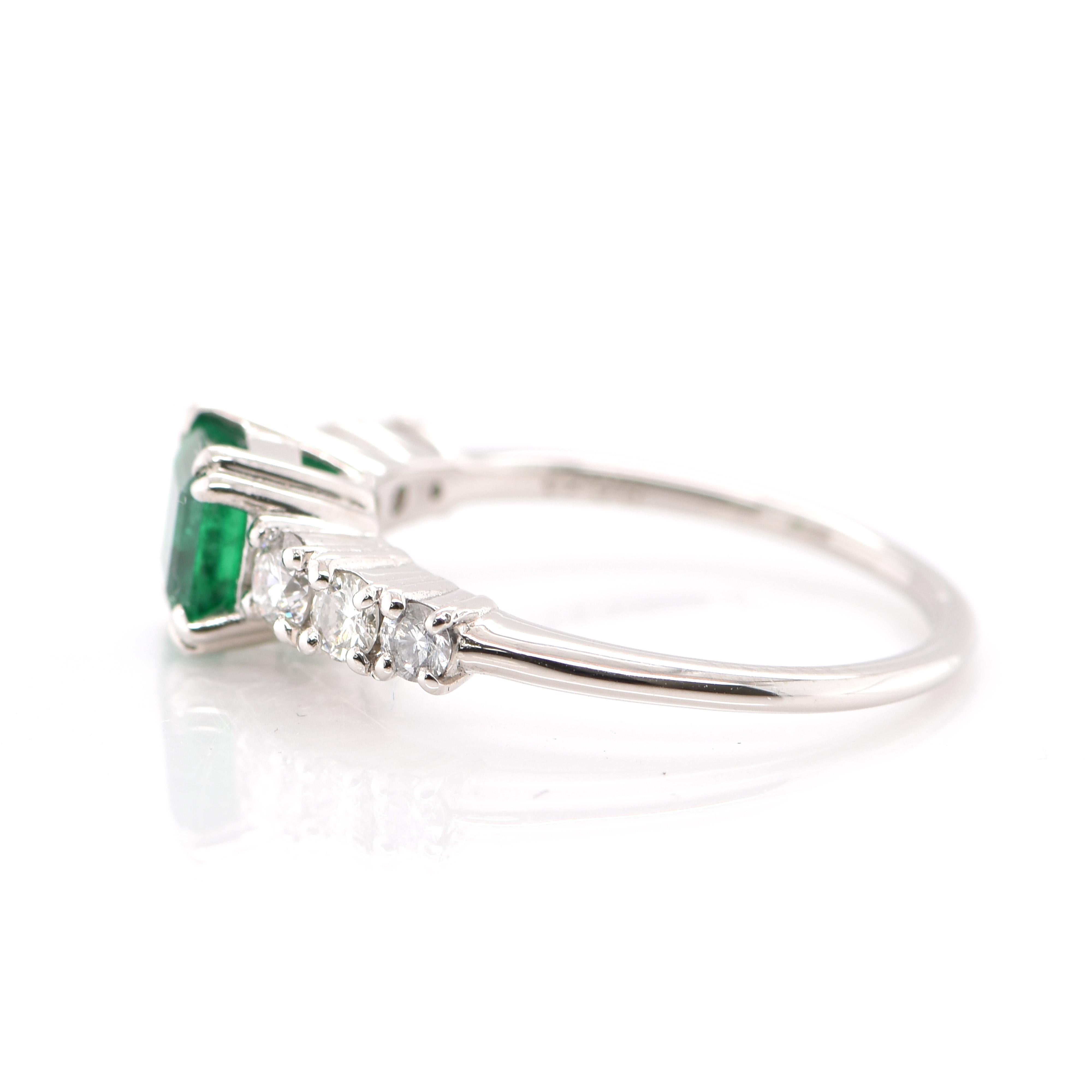 Emerald Cut 0.74 Carat Natural Emerald and Diamond Engagement Ring Set in Platinum For Sale