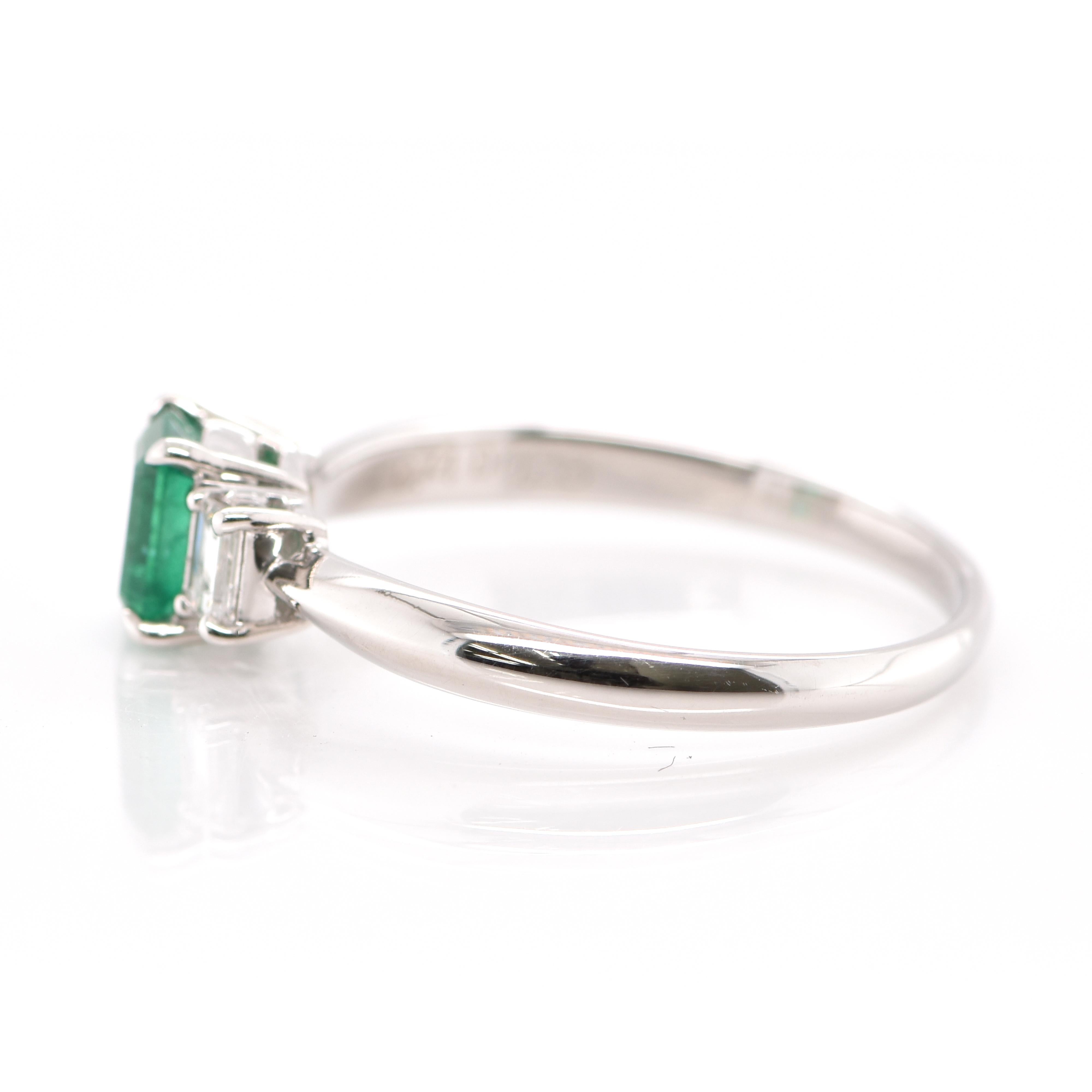 Emerald Cut 0.74 Carat Natural Emerald and Diamond Engagement Ring Set in Platinum