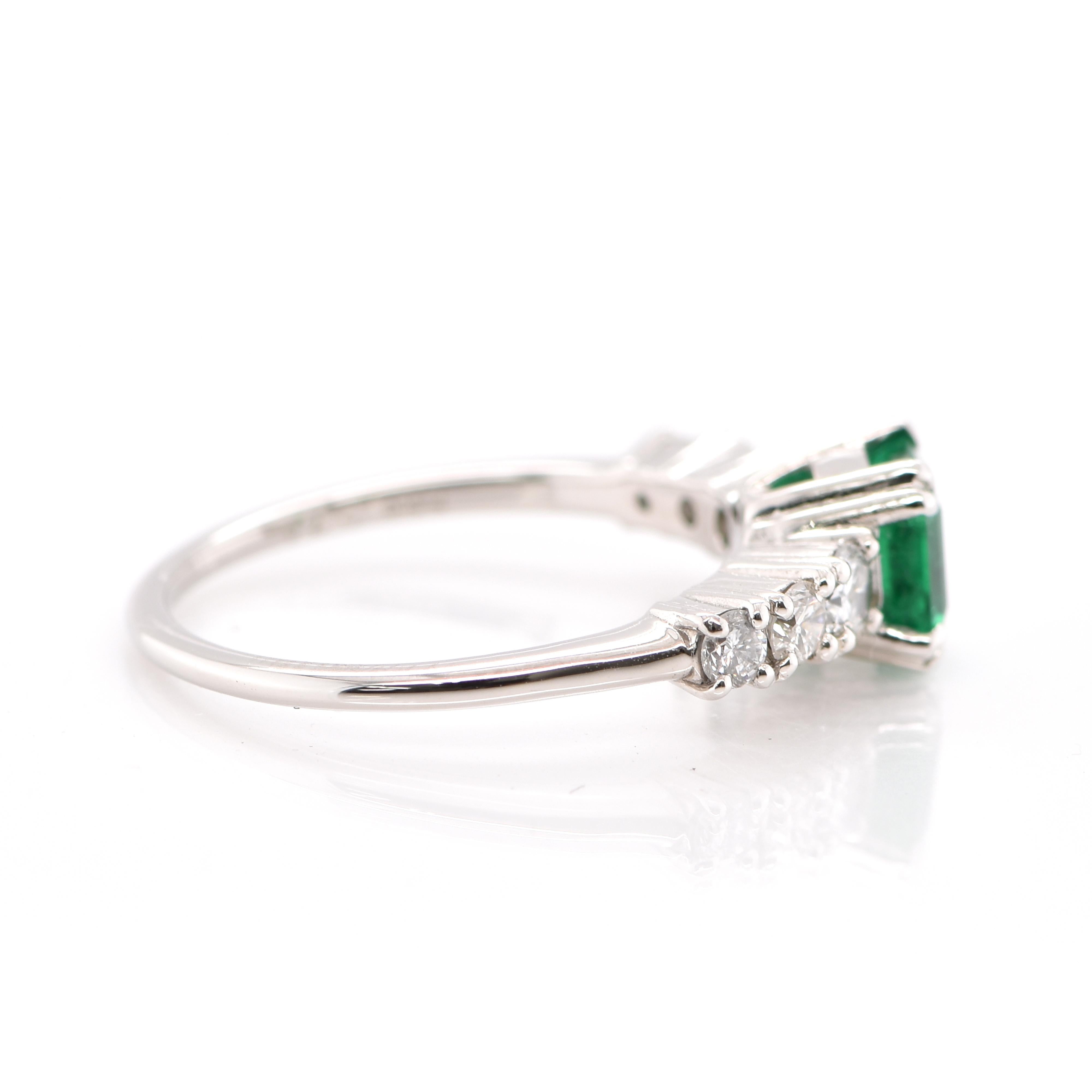 0.74 Carat Natural Emerald and Diamond Engagement Ring Set in Platinum In New Condition For Sale In Tokyo, JP