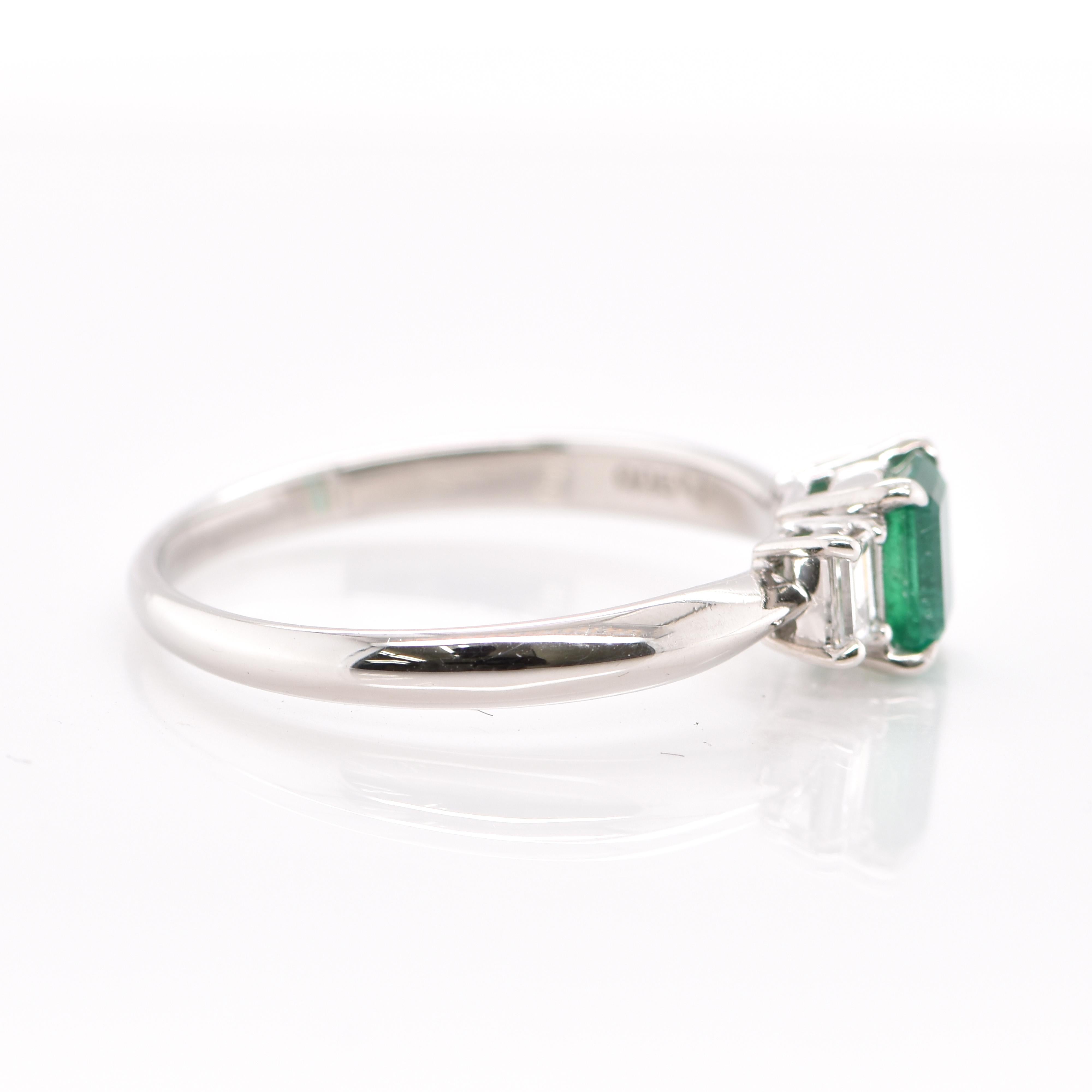 0.74 Carat Natural Emerald and Diamond Engagement Ring Set in Platinum In New Condition In Tokyo, JP