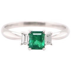 0.74 Carat Natural Emerald and Diamond Engagement Ring Set in Platinum