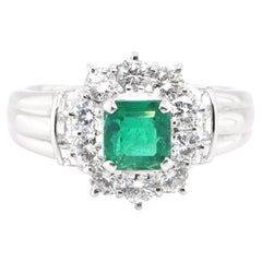 0.74 Carat Natural Emerald and Diamond Halo Ring Set in Platinum