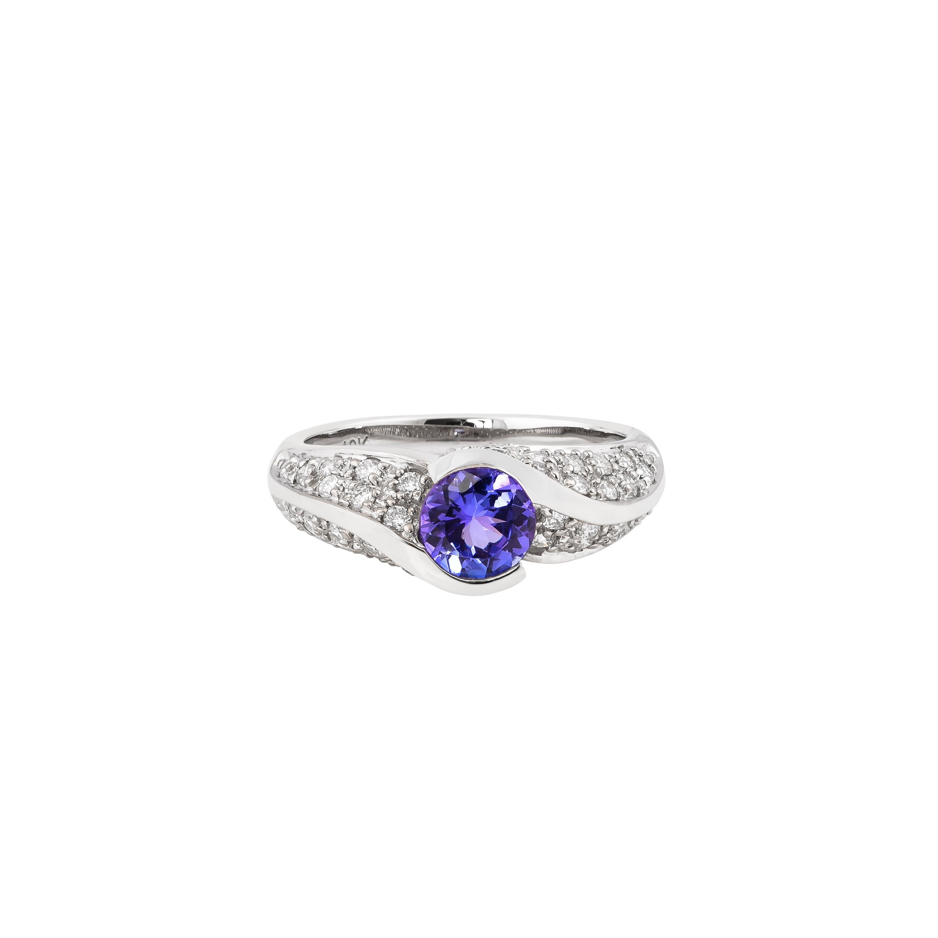 Round Cut 0.74 Carat Tanzanite Ring in 18 Karat White Gold with Diamond. For Sale