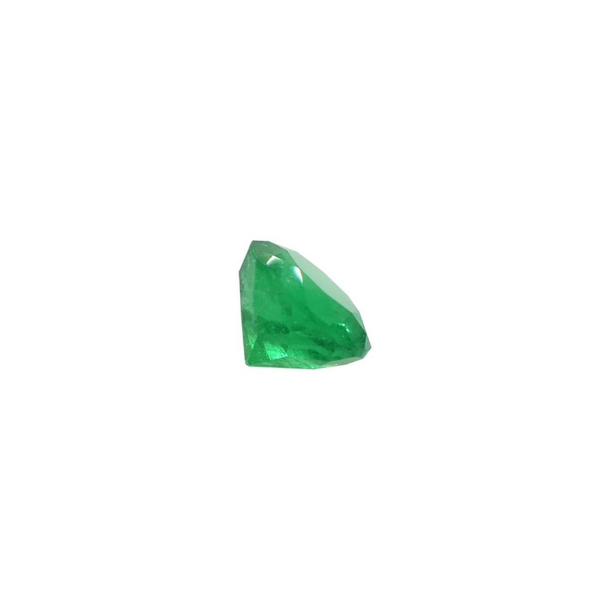 This fantastic 0.74 carats round cut loose emerald is the perfect example of high-quality natural Colombian emeralds. This gem presents a medium-dark green color with strong saturation that creates a vivid 