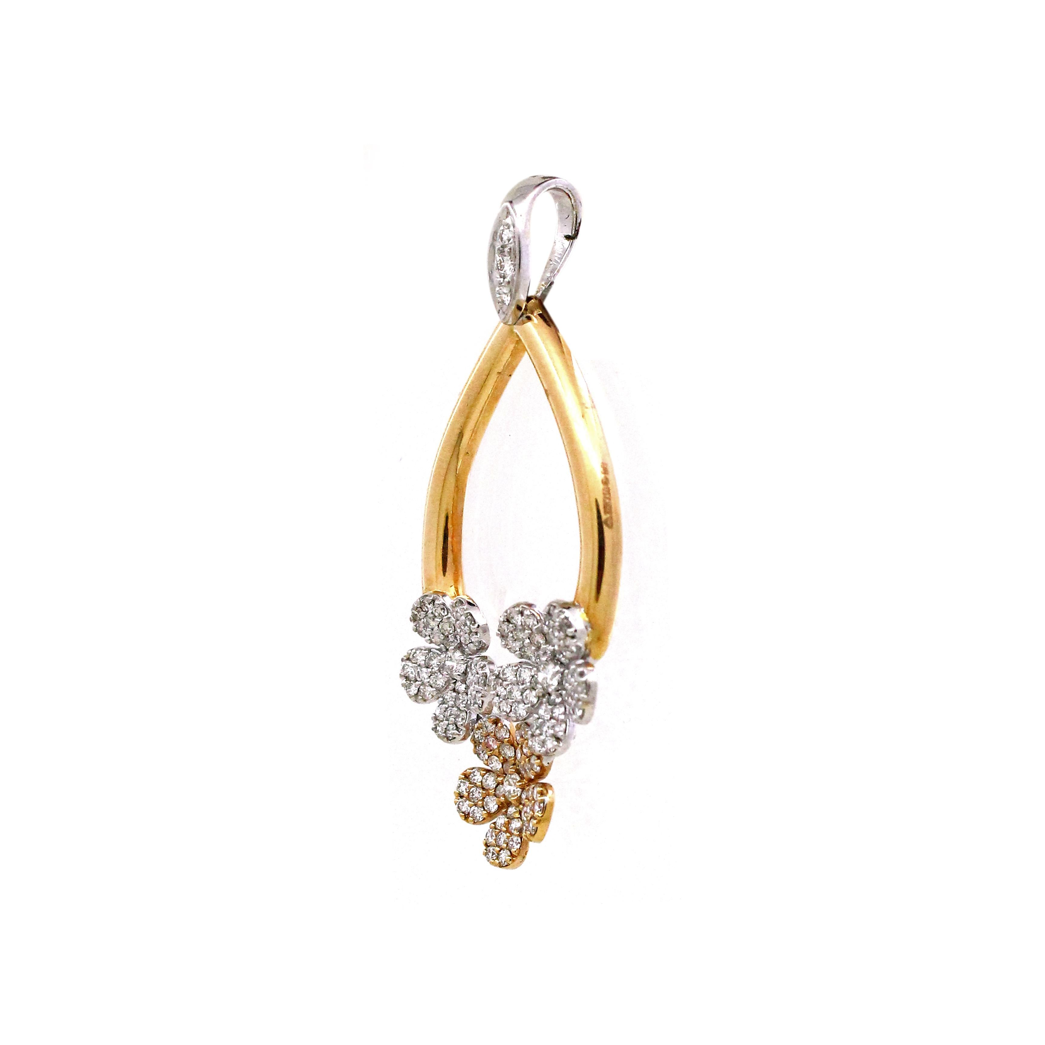 Discover the epitome of youthful elegance with our enchanting pendant, crafted from the finest 18k yellow and white gold, weighing a delicate 3.63 grams. Embodying a timeless charm, this pendant boasts three distinct flower-shaped clusters, each