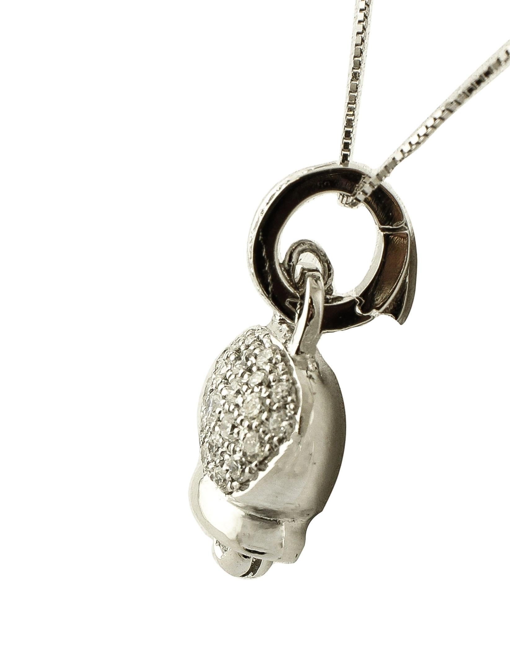 Elegant and simple pendant necklace, realized in 18K white gold with bell shape adorned with 0.74 ct of little white diamonds. The chain is included.
Diamonds 0.74 ct 
Total Weight 6.70 g 
R.F + uiri
Dimention 25 mm X 14 mm 

For any