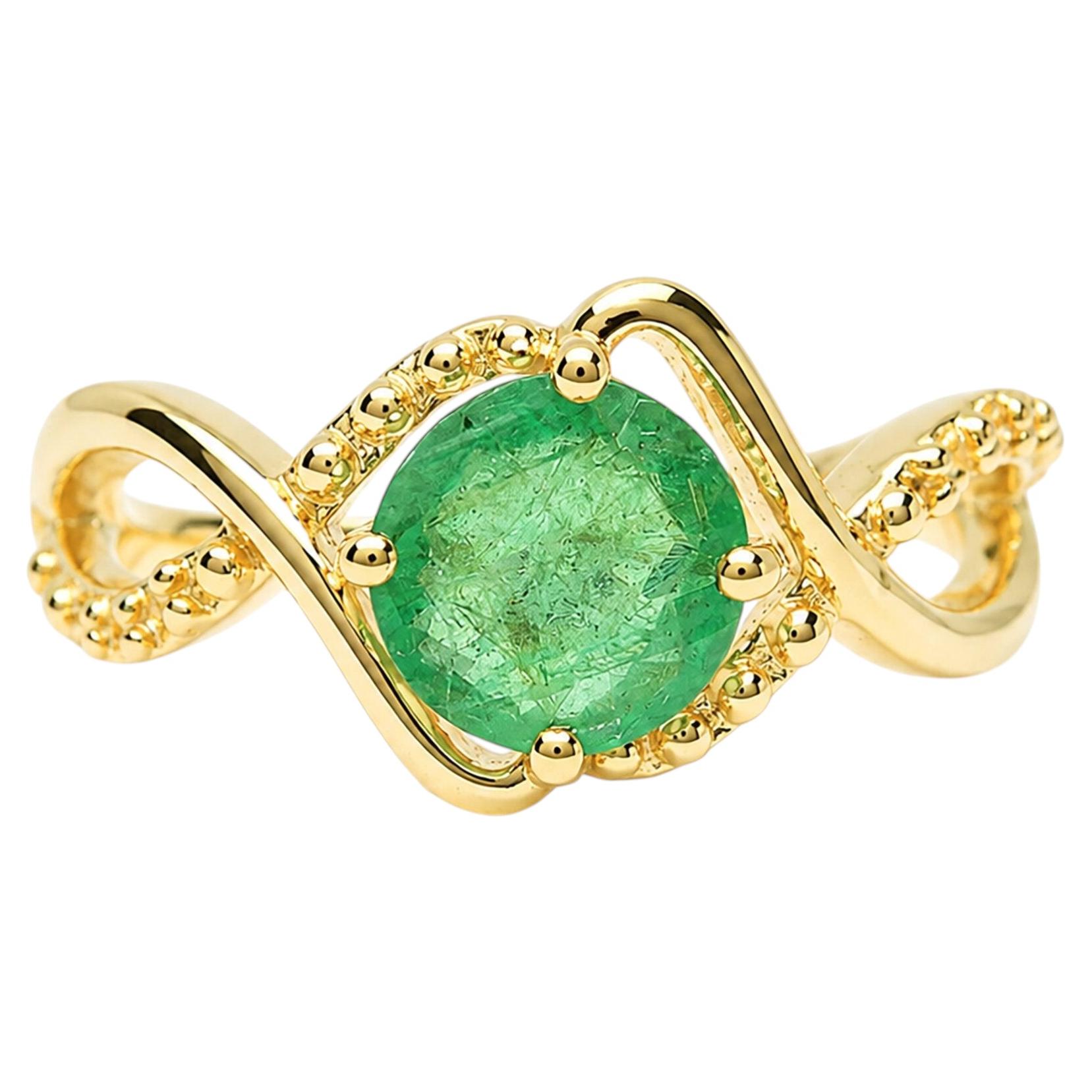 Anillo solitario con esmeralda de Zambia de 0,74 ct, con una delicada banda de oro amarillo de 14K