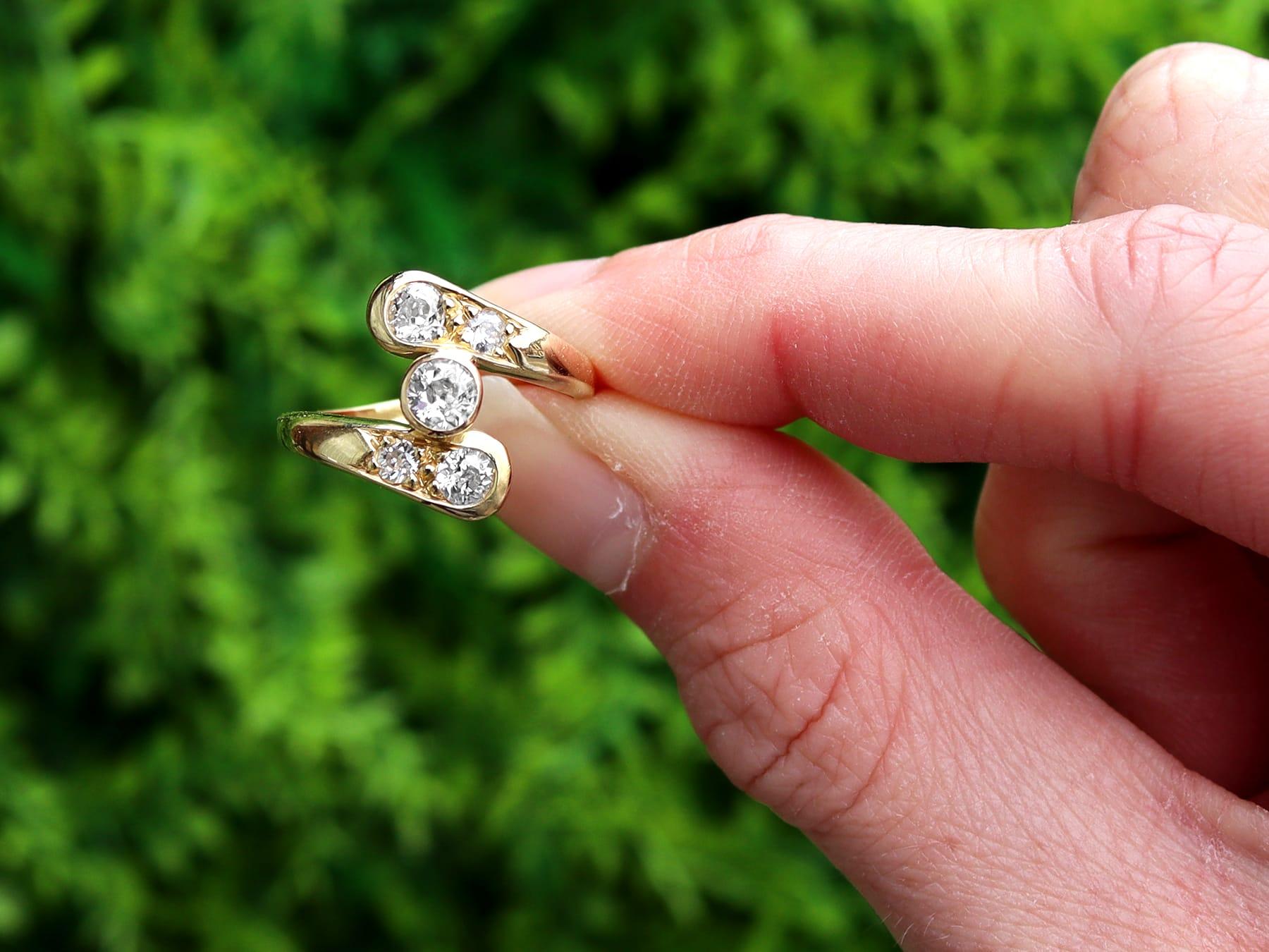 A stunning, fine and impressive antique 0.74 carat diamond and vintage 18 karat yellow gold twist ring; part of our collection of diamond twist rings.

This stunning, fine and impressive twist ring has been crafted in 18k yellow gold.

The twist