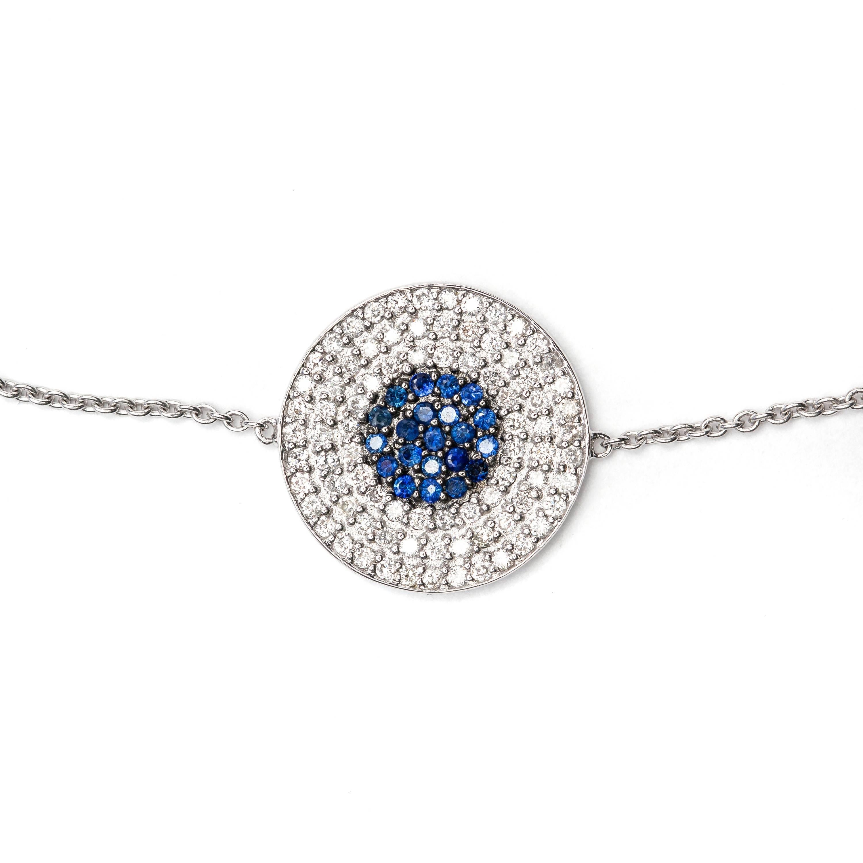This luxurious 0.25ct H-SI1 Round Brilliant Diamond bracelet sparkles stunningly featuring 0.25ct Blue Pavé sapphire in the center. Adorn your wrist with this elegant piece of jewelry set in 18 Karat White Gold.