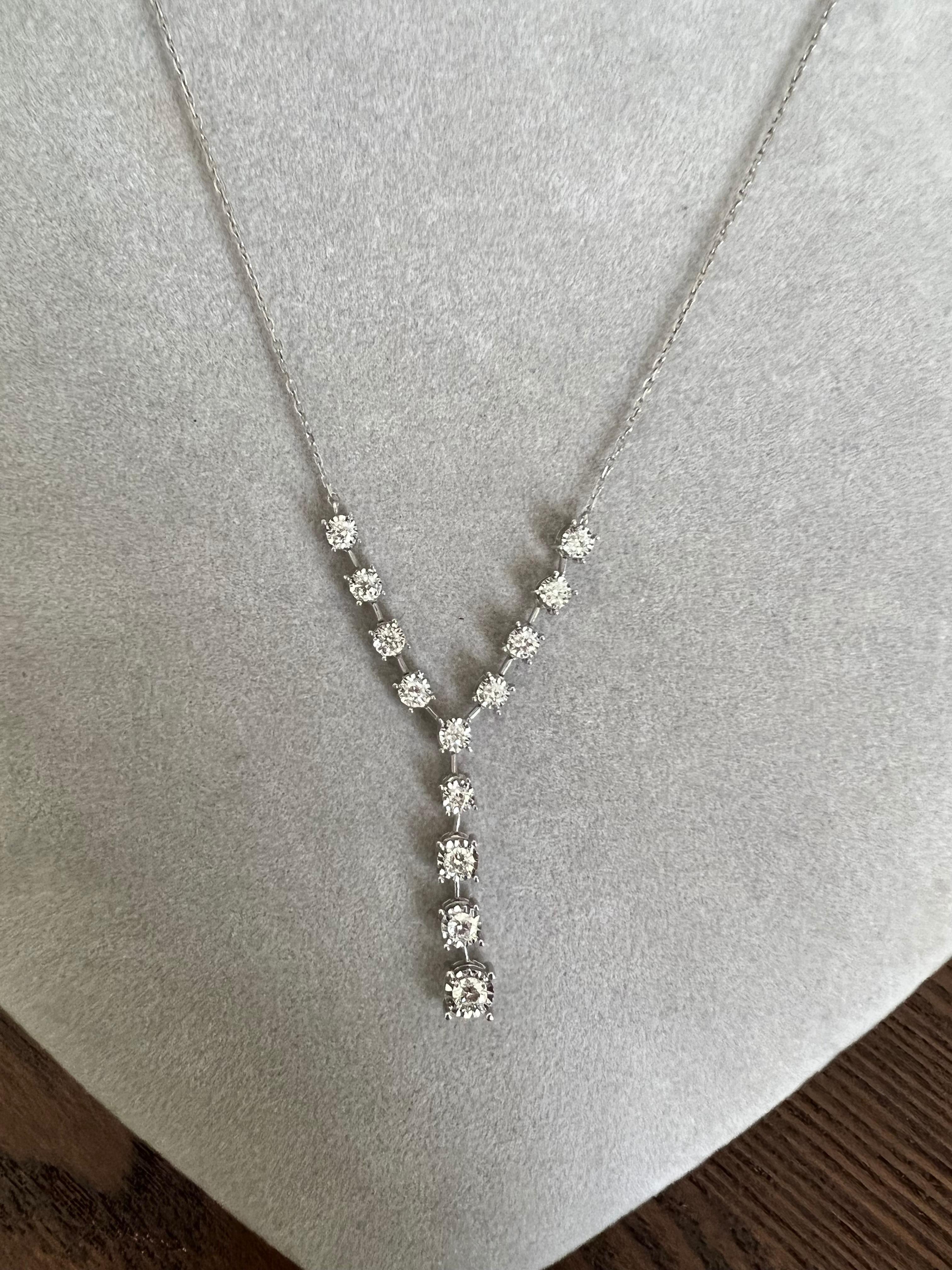 This chain necklace has 13 Natural Round Cut Diamonds that weigh 0.75 carats. The clarity and color of the necklace are SI-F.

The approximate weight of this necklace is 3.5 grams. 

The necklace is 16 inches long. 