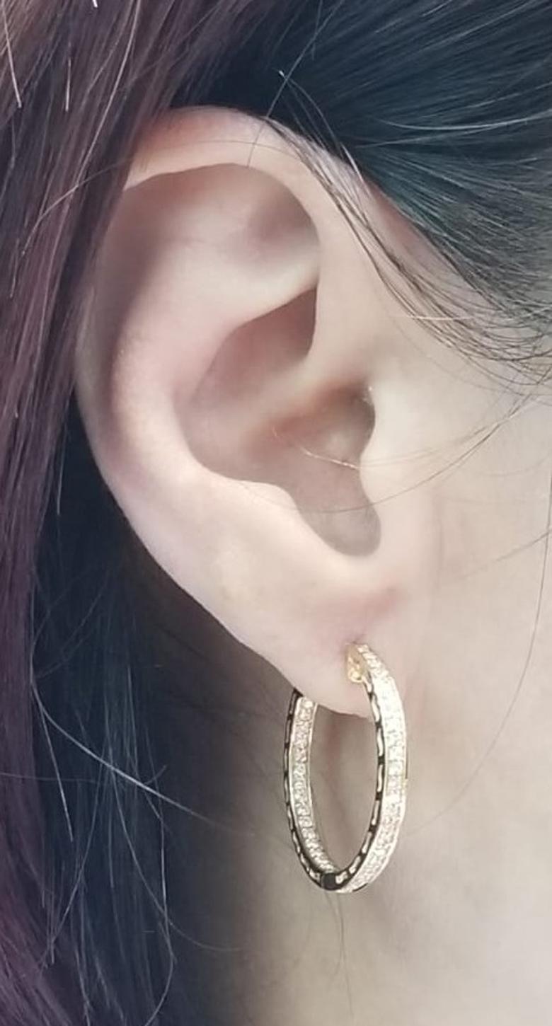 This hoop earrings feature 0.74carat of round brilliance diamond set in 14 karat yellow gold. Great for everyday use. 
Diameter 1 inch
14 Karat Yellow Gold
Round Brilliance Diamonds 0.74 carat