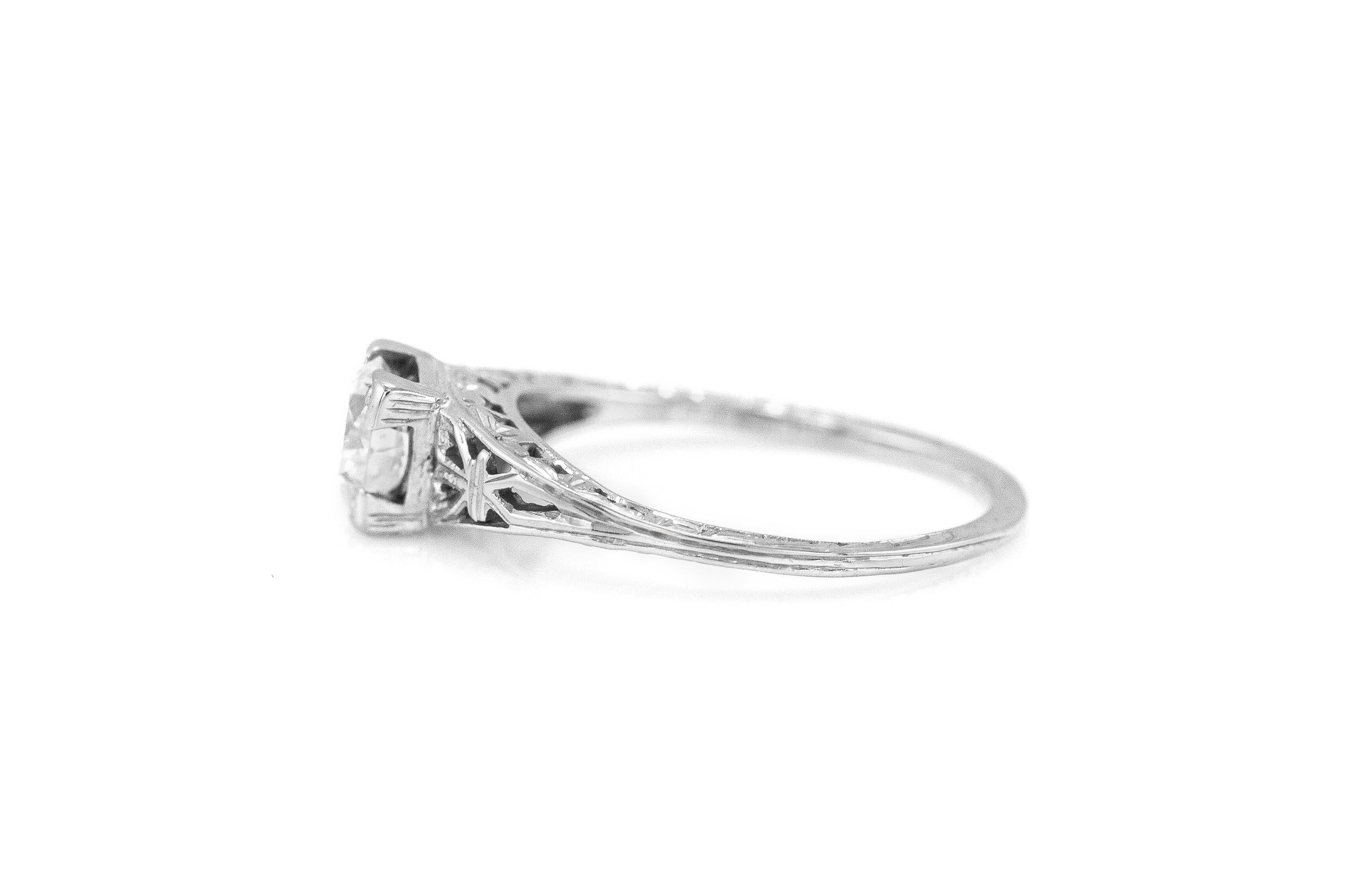 Center diamond weighing 0.75 carat in 14K white gold Art Deco setting. 