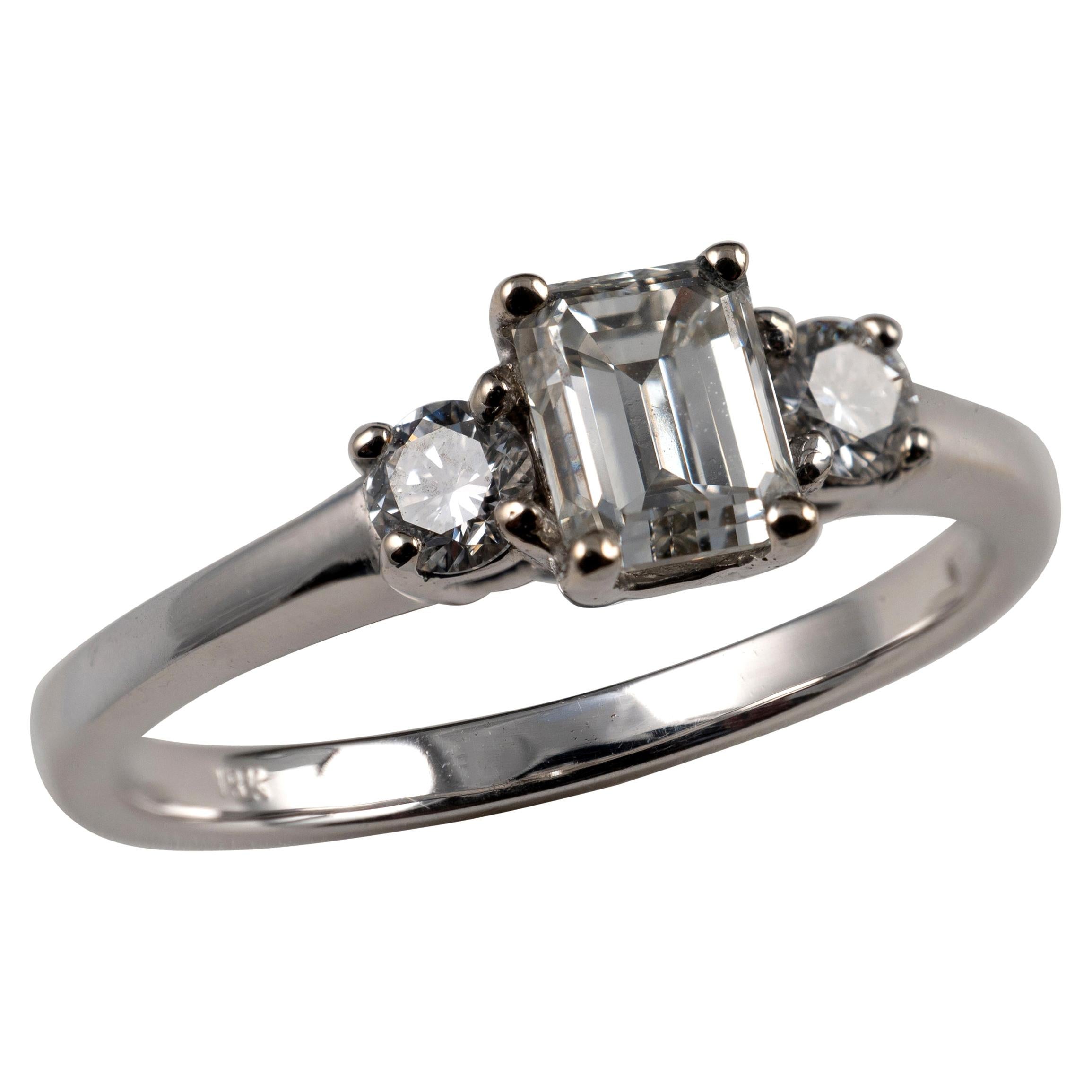 0.75 Carat Emerald Cut & Round Cut Diamond Ring 18 Karat White Gold Hallmarked For Sale