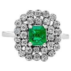 0.75 Carat Emerald Cut Green Emerald with Round Diamond Cluster Antique Ring