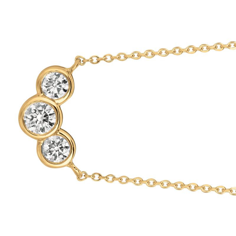 0.75 Carat Natural 3 Stone Diamond Bezel Necklace 14K Yellow Gold G SI
T

100% Natural Diamonds, Not Enhanced in any way Round Cut Diamond Necklace with 18'' chain
0.75CT
G-H
SI
14K Yellow Gold Bezel style 2.9 gram
5/16 inches in height, 9/16 inches