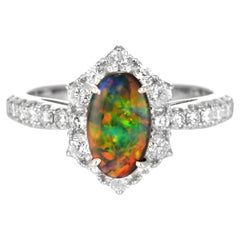 0.75 Carat Natural Australian Black Opal and Diamond Ring Made in Platinum