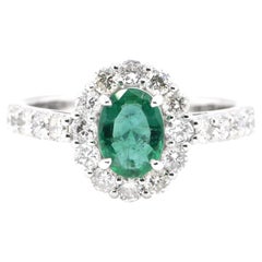 0.75 Carat Natural Emerald and Diamond Ring Set in Platinum