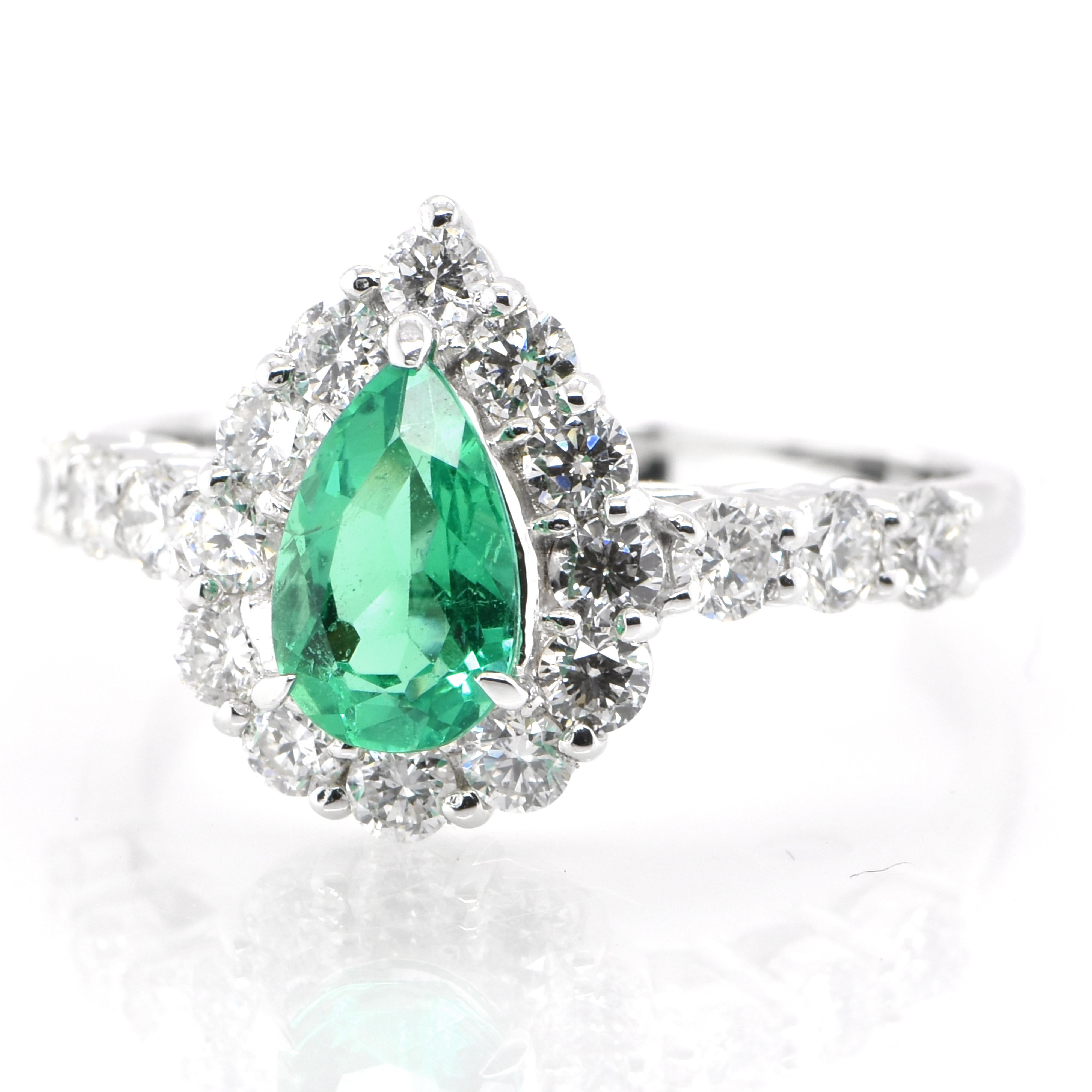 A stunning halo engagement ring featuring a 0.75 Carat Natural Pear-Cut Emerald and 0.78 Carats of Diamond Accents set in Platinum. People have admired emerald’s green for thousands of years. Emeralds have always been associated with the lushest