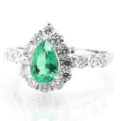 0.75 Carat Natural Pear-Cut Emerald and Diamond Halo Ring Set in Platinum