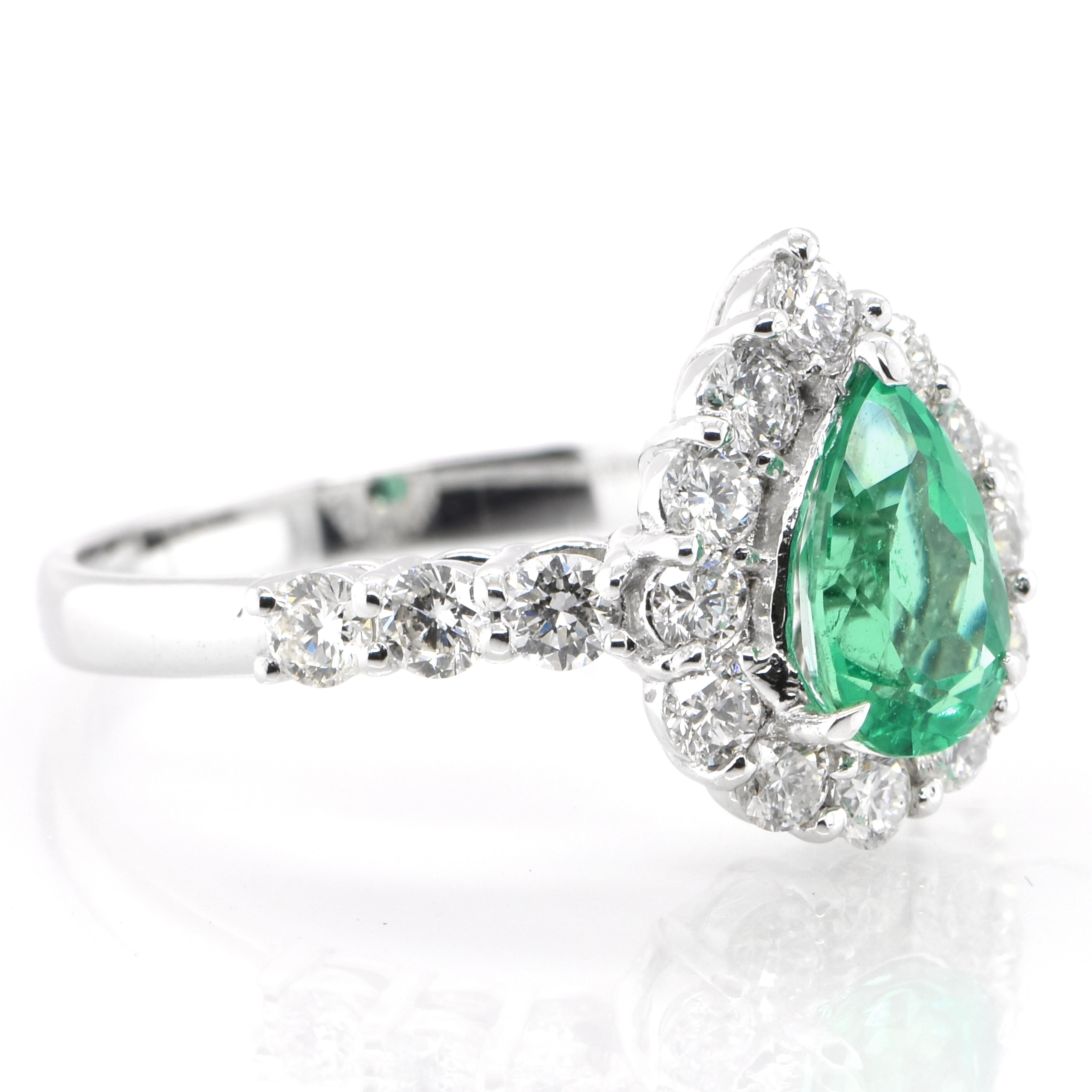 Modern 0.75 Carat Natural Pear-Cut Emerald and Diamond Halo Ring Set in Platinum For Sale