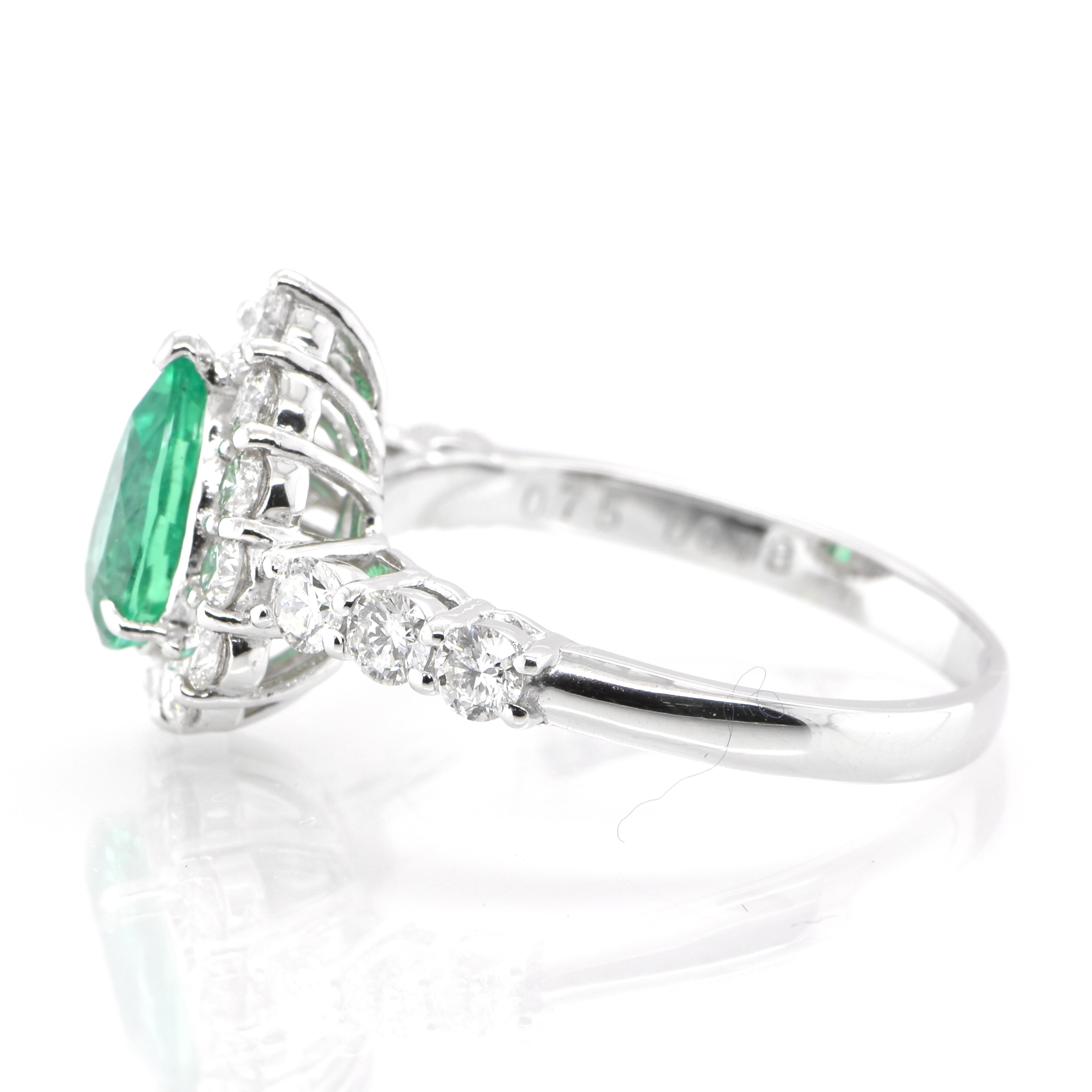 Pear Cut 0.75 Carat Natural Pear-Cut Emerald and Diamond Halo Ring Set in Platinum For Sale
