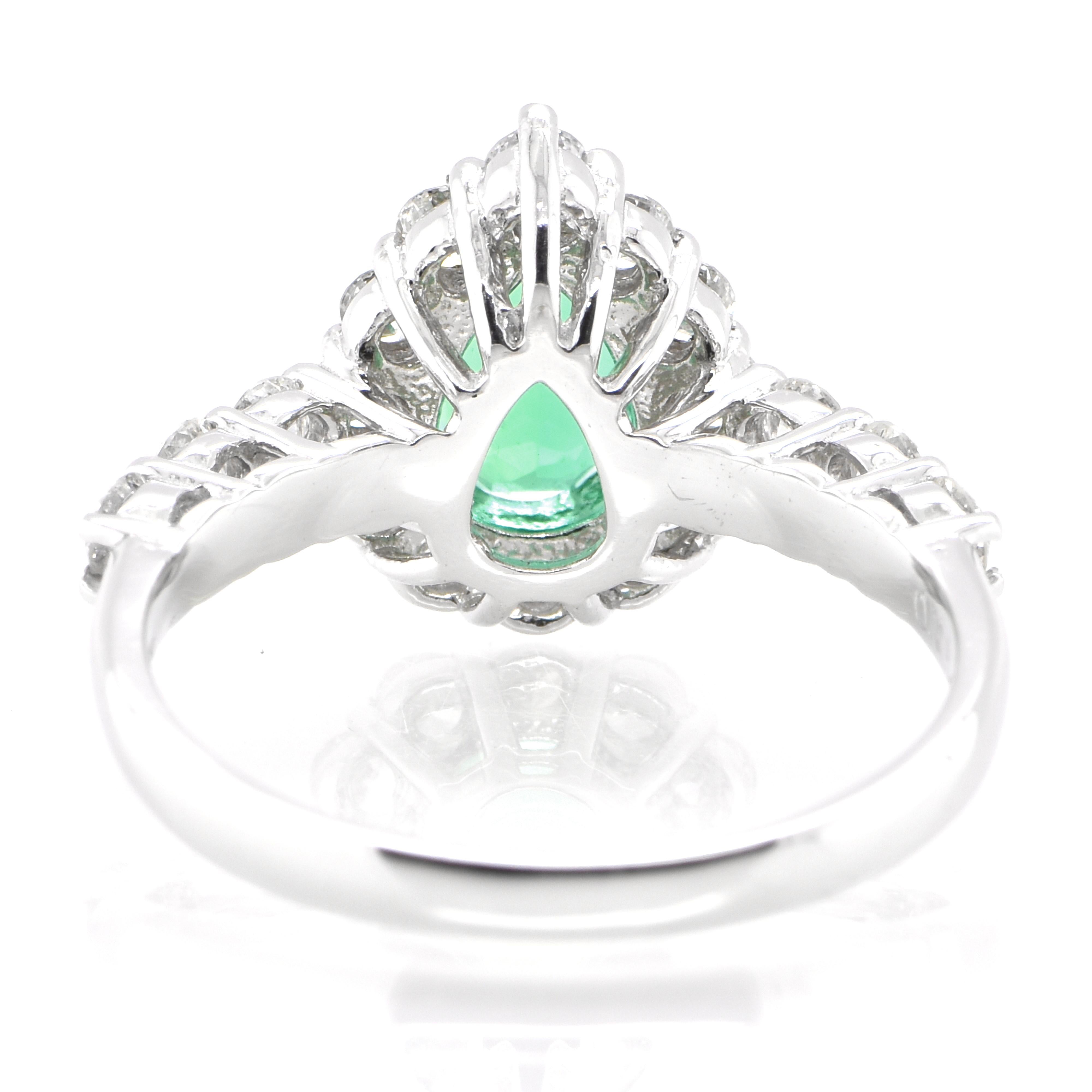 Women's 0.75 Carat Natural Pear-Cut Emerald and Diamond Halo Ring Set in Platinum For Sale