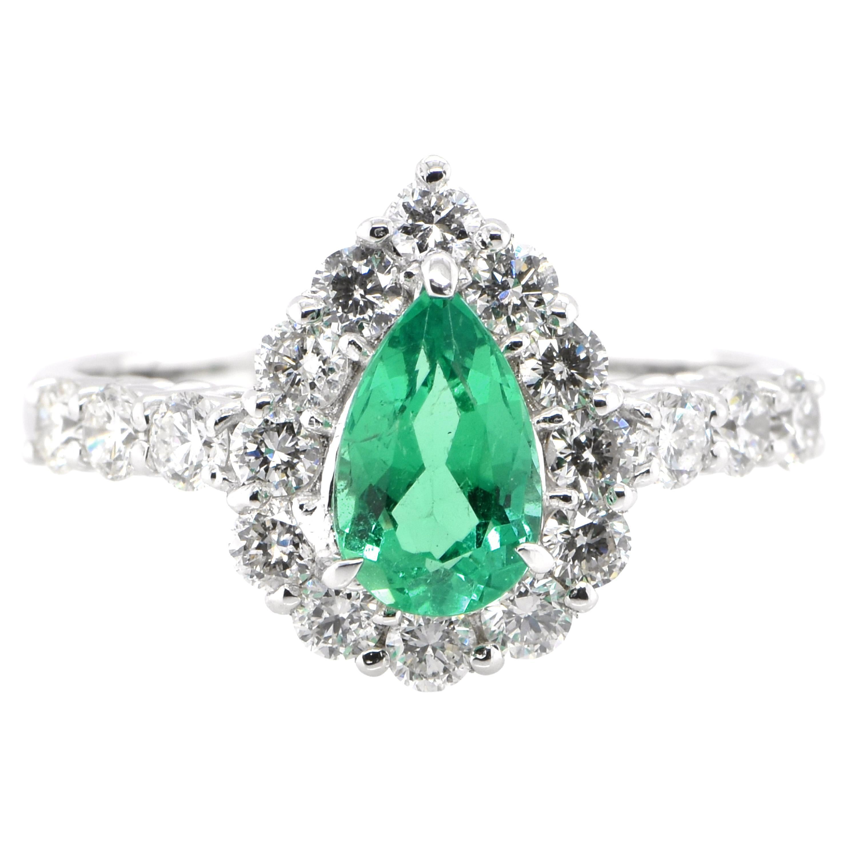 0.75 Carat Natural Pear-Cut Emerald and Diamond Halo Ring Set in Platinum