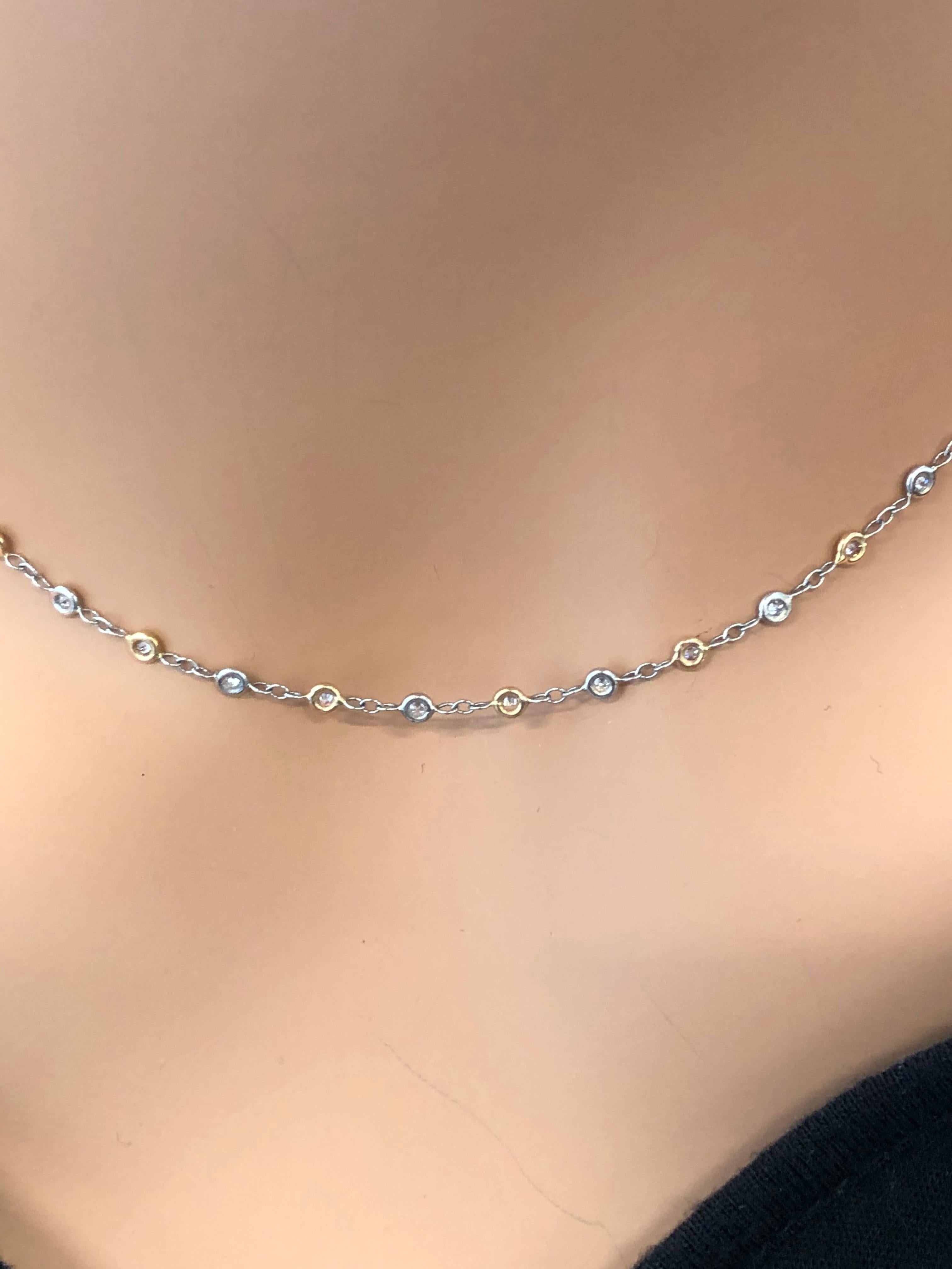 Designed in brightly polished platinum and 18 karat rose gold,  this beautiful diamond two-tone necklace features a total of 27 round cut white diamonds with a weight of 0.40 carats and have E-F color and VVS clarity. A total of 0.35 carats of round