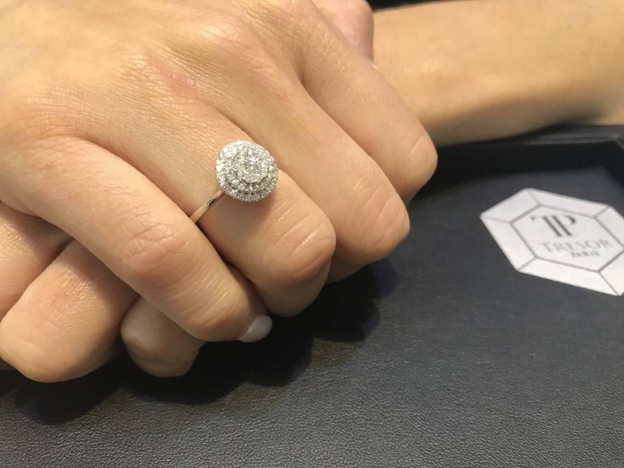 This remarkable 0.75 Carat White Round Cut Diamond Cluster Double Halo ring is set in 18 Karat White Gold and color H clarity SI1. Ring size UK - L, US - 6. Available in other carat sizes as well as ring sizes. British hallmarked by the London Assay