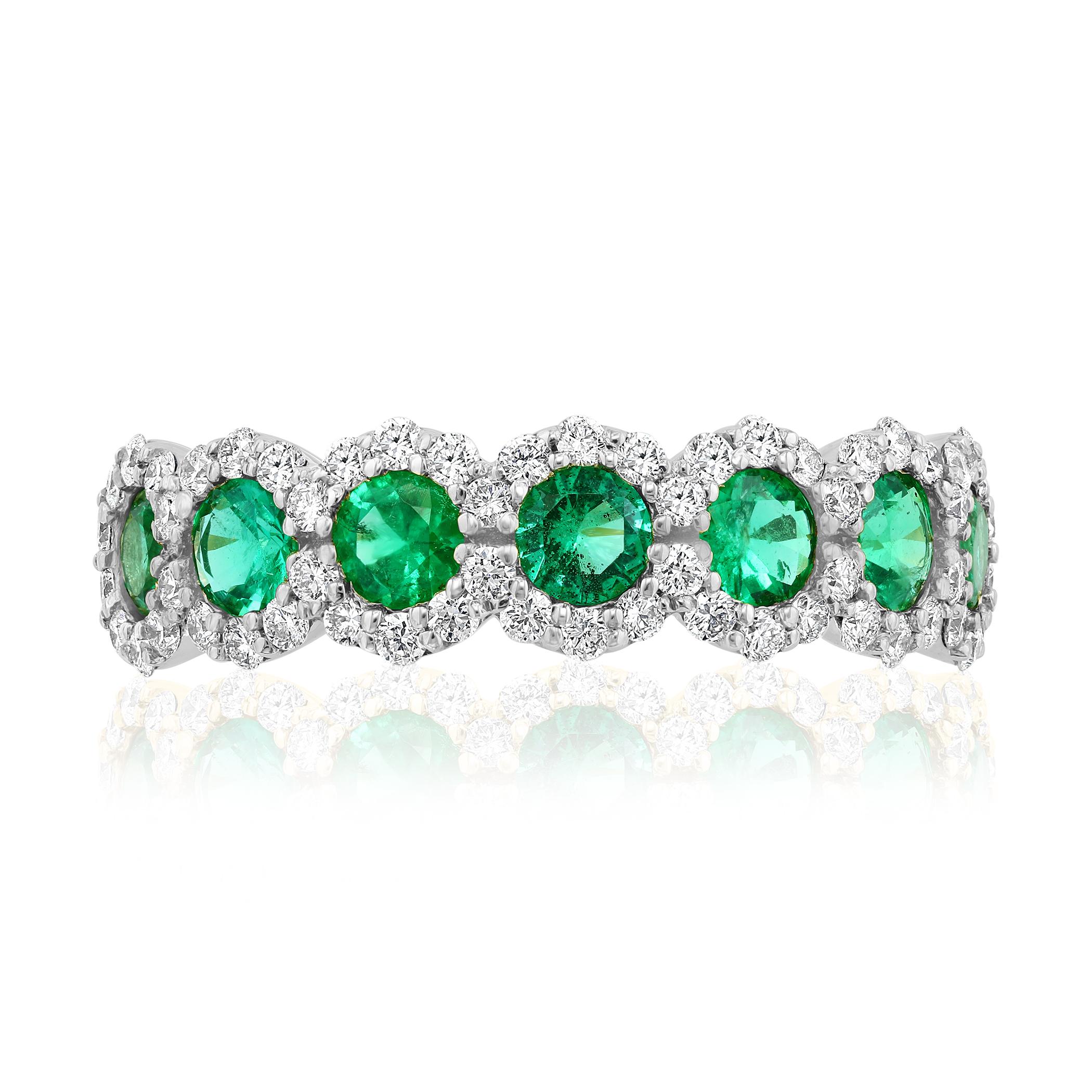 A fashionable and classic wedding band showcasing 7 color-rich green emeralds weighing 0.75 carats total that are surrounded by brilliant round diamonds weighing 1.00 carats total. Stones secured with a micro pave setting made with 14karat white